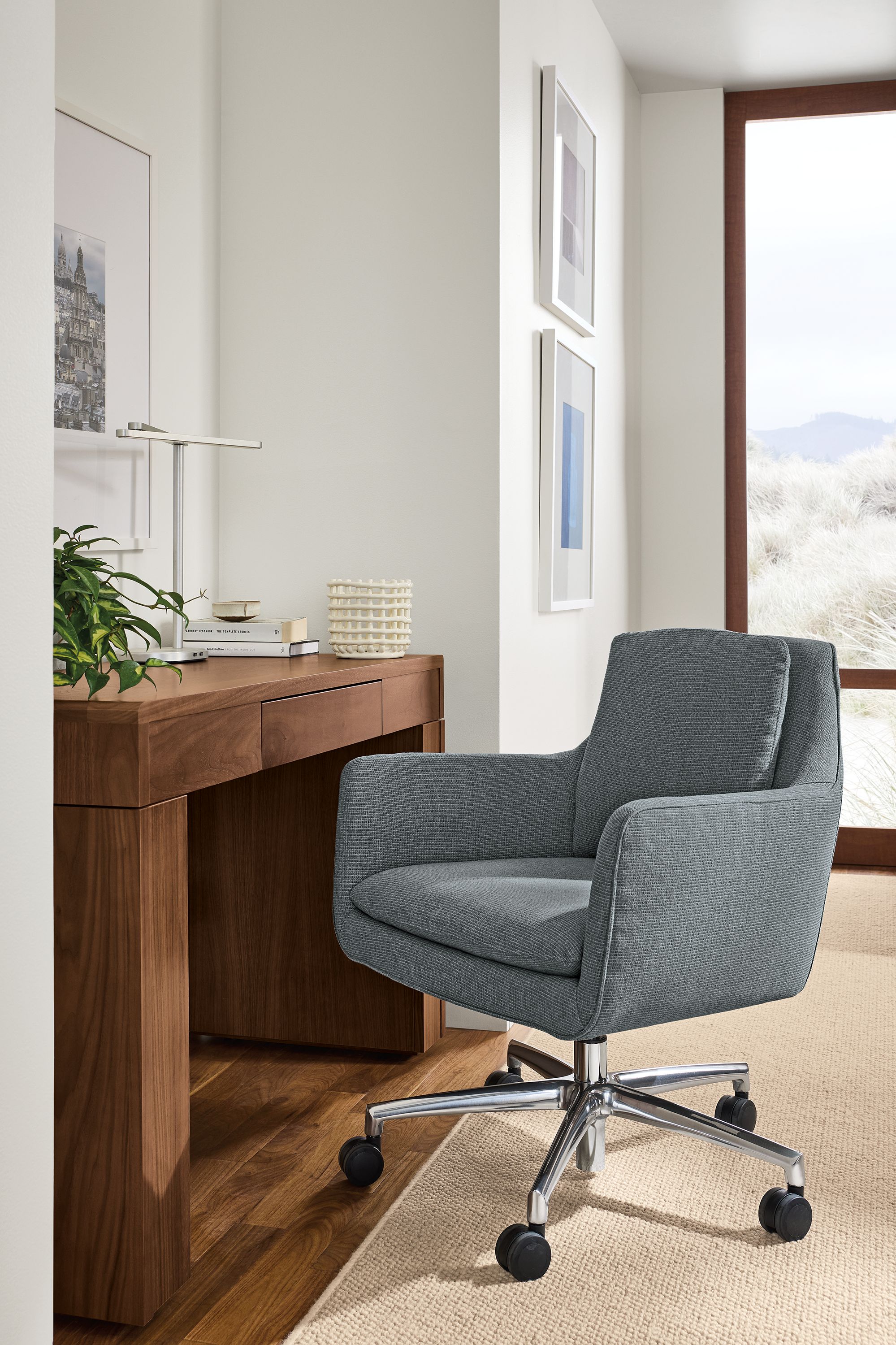Home desk area with Penny office chair in Kesler Slate and Lincoln console desk in walnut.