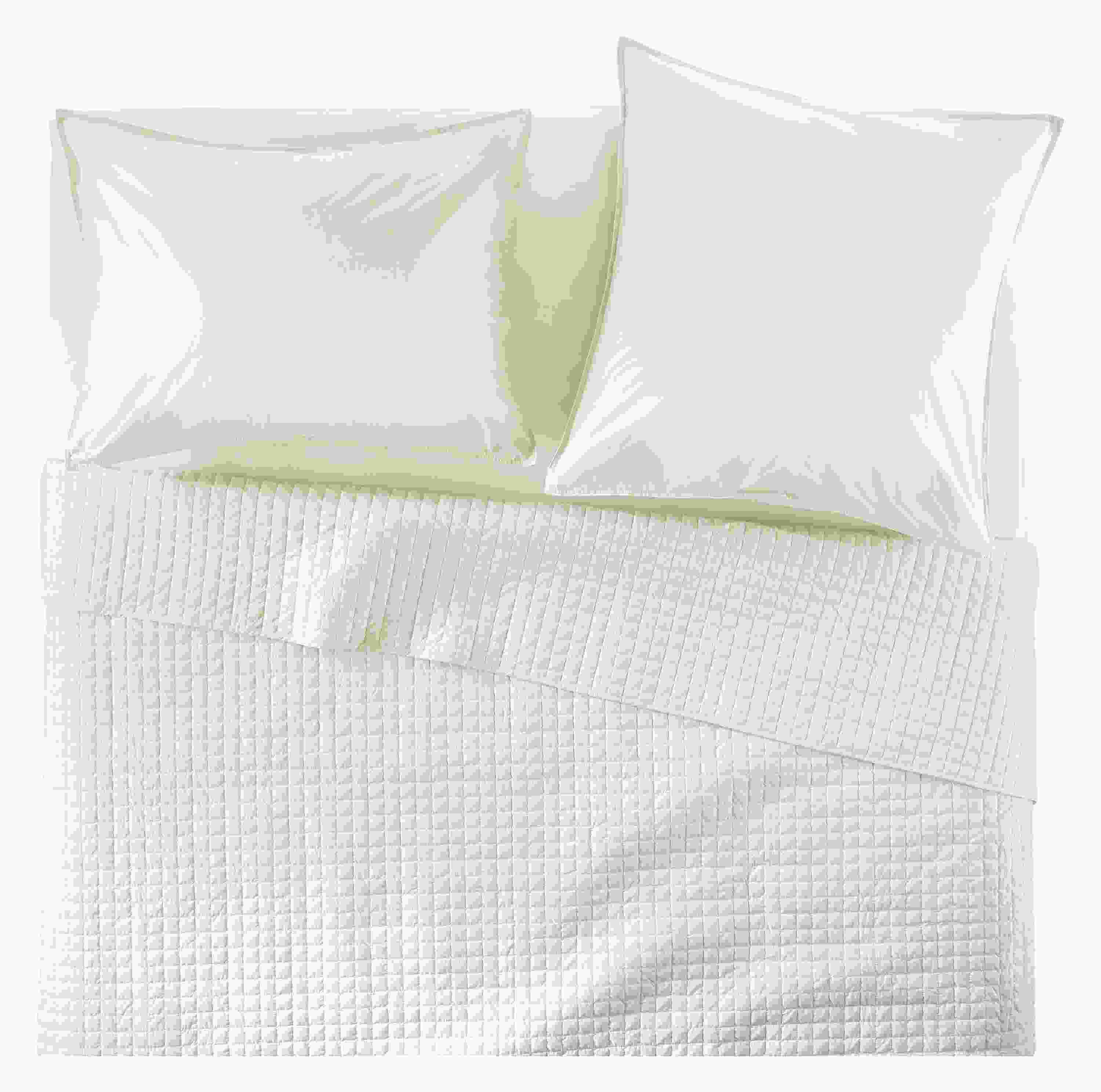 Overhead view of Core queen bed with Signature Percale quilted coverlet, fitted sheet and shams in Ecru.