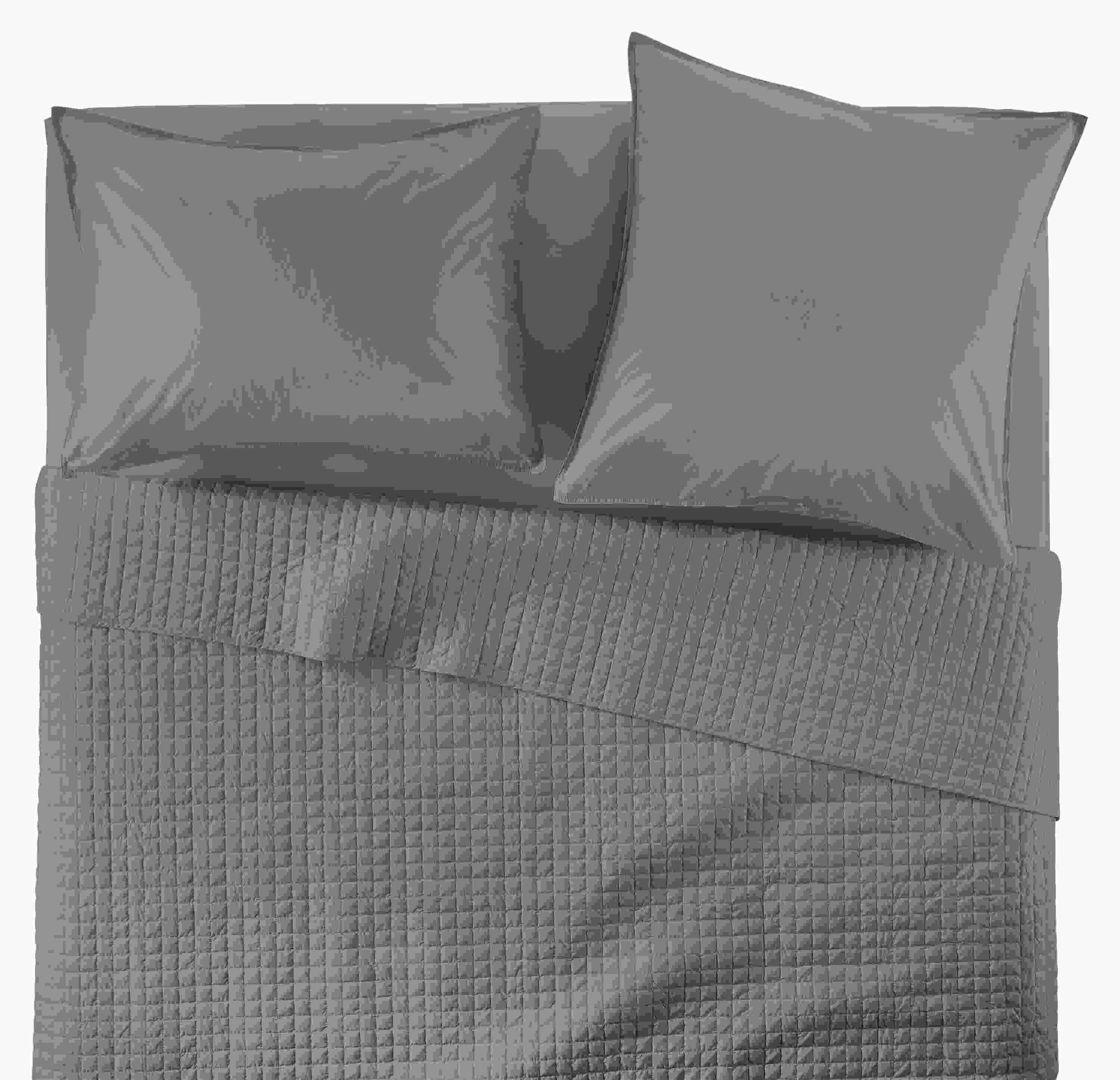 Overhead view of Core queen bed with Signature Percale quilted coverlet, fitted sheet and shams in charcoal.