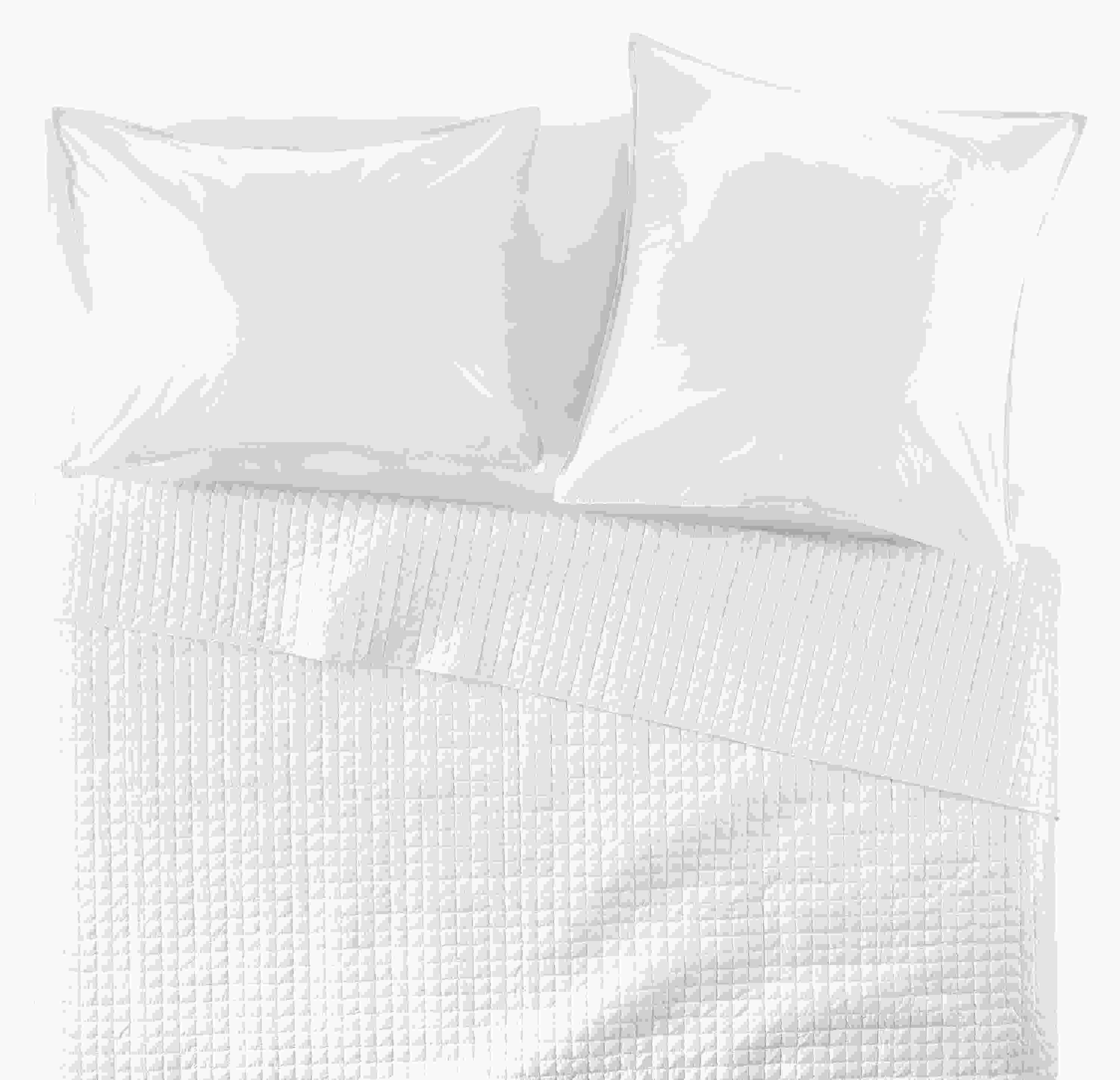 Overhead view of Core queen bed with Signature Percale quilted coverlet, fitted sheet and shams in white.
