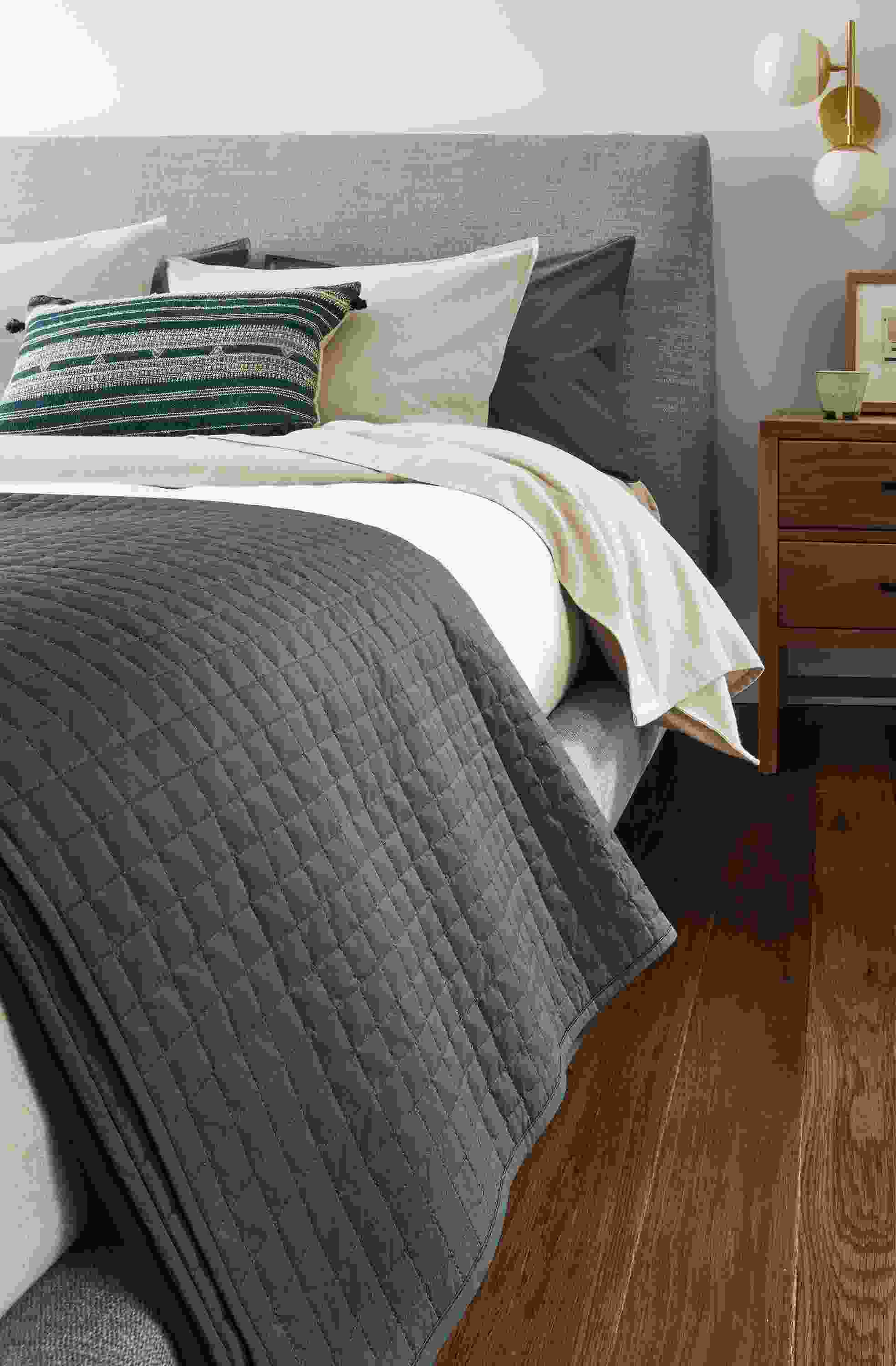 Bedroom with close-up of Signature Percale coverlet in dark slate on an Ella Queen Bed in Hawkins Cement.