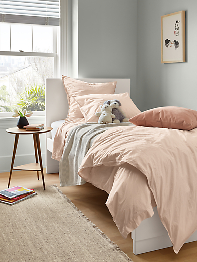Bedroom setting with Signature percale bedding in blush.