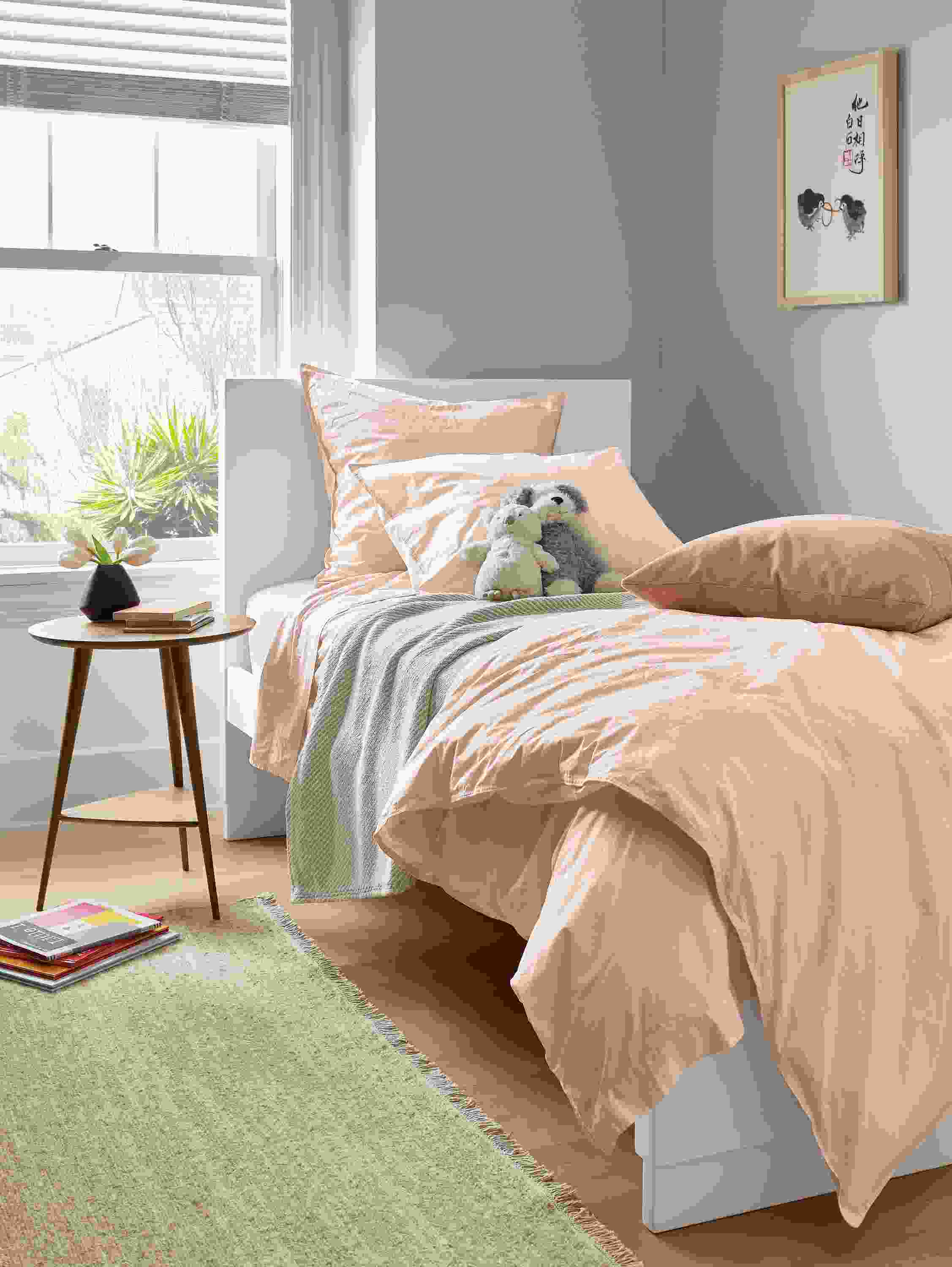 Bedroom setting with Signature percale bedding in blush.