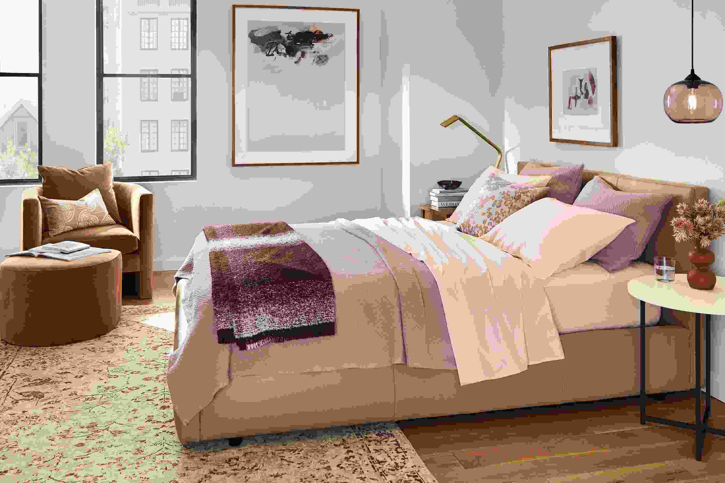 Bedroom setting with signature percale in blush and thea coverlet and sham on wyatt bed.