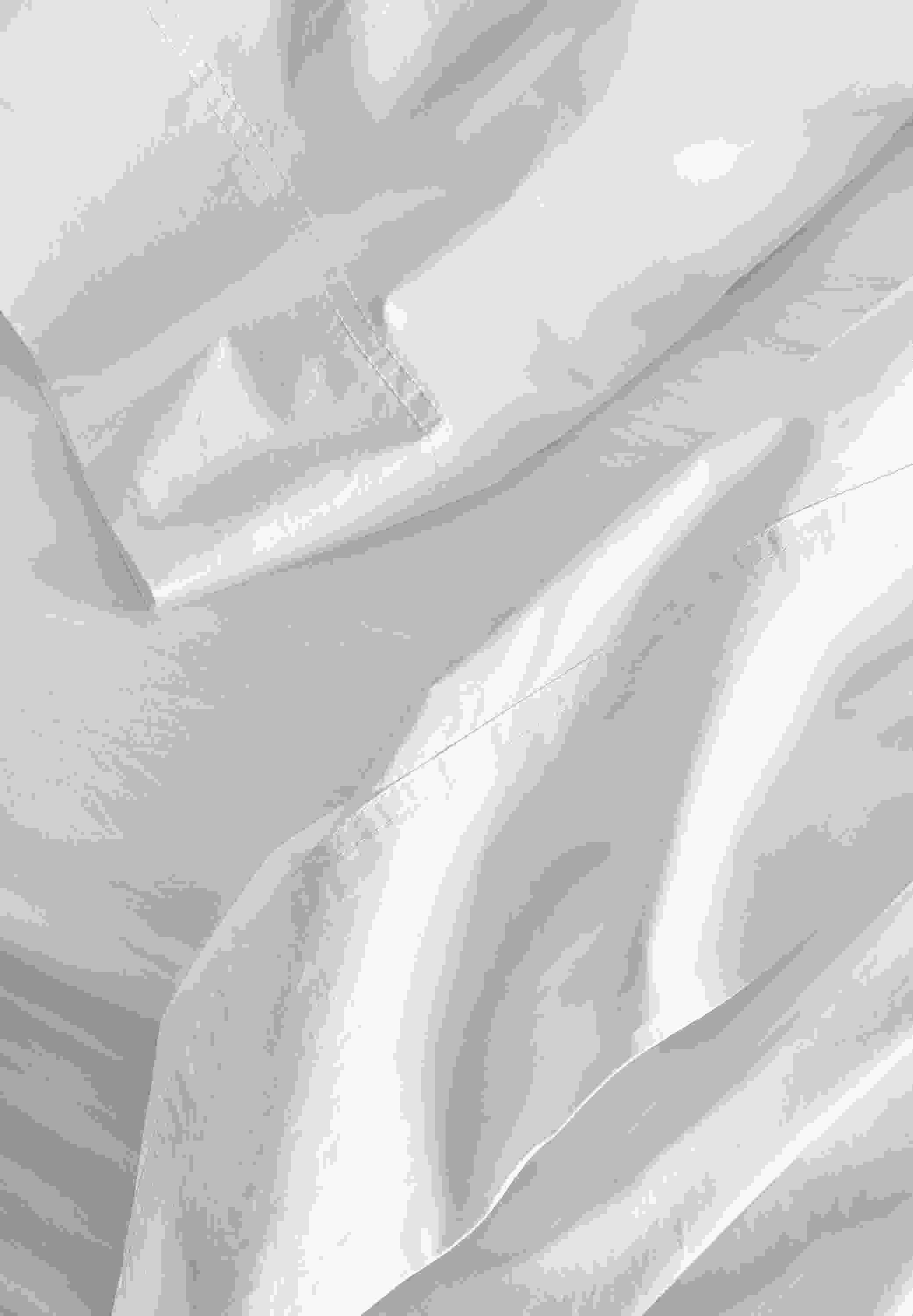 Detail view of signature percale bedding in white.