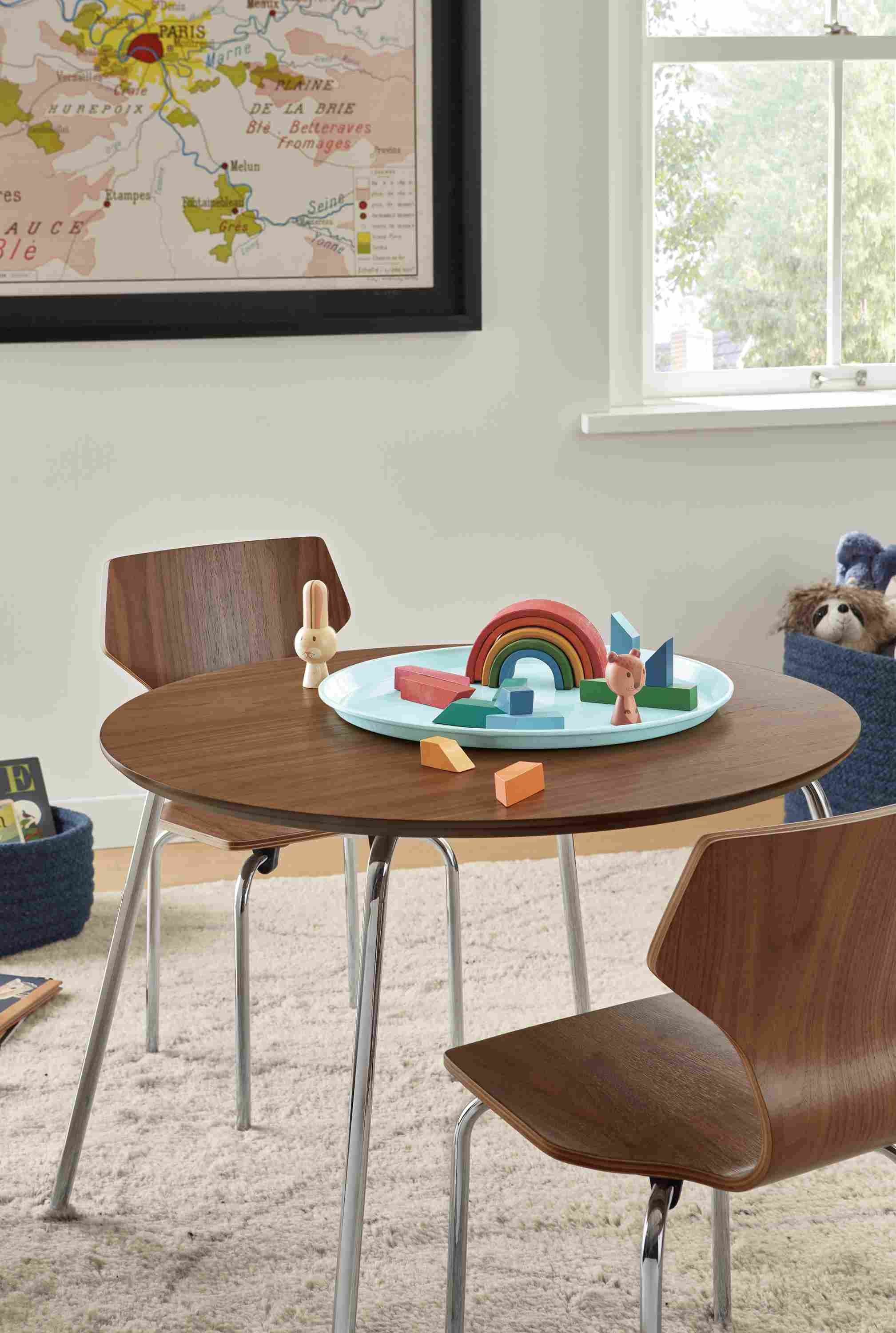 Room setting with percha table and chairs in walnut with chrome base.