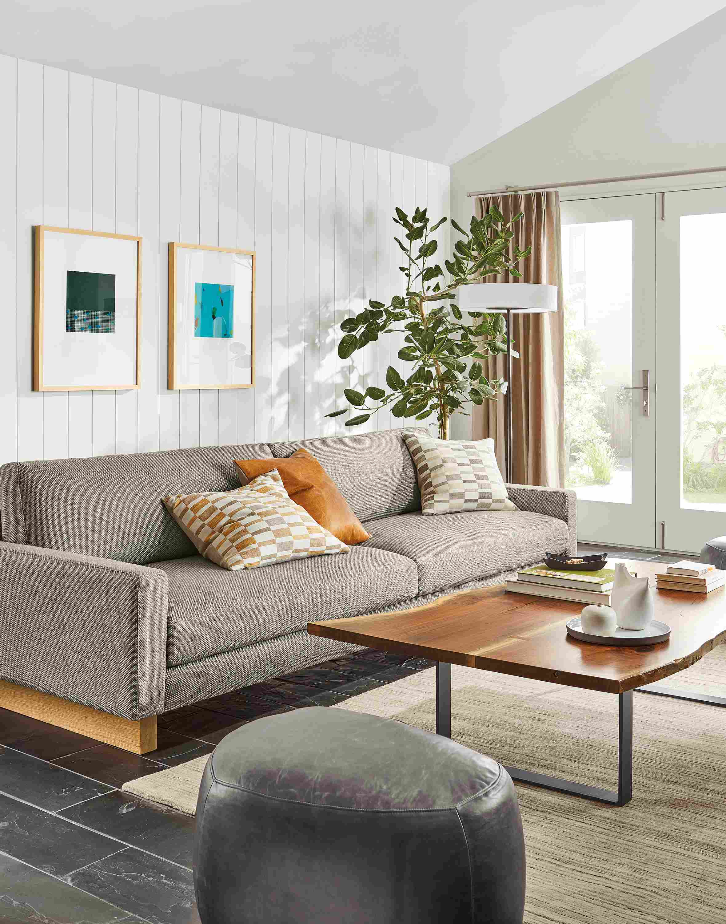 living room with pierson sofa in arin gray fabric next to chilton walnut coffee table.