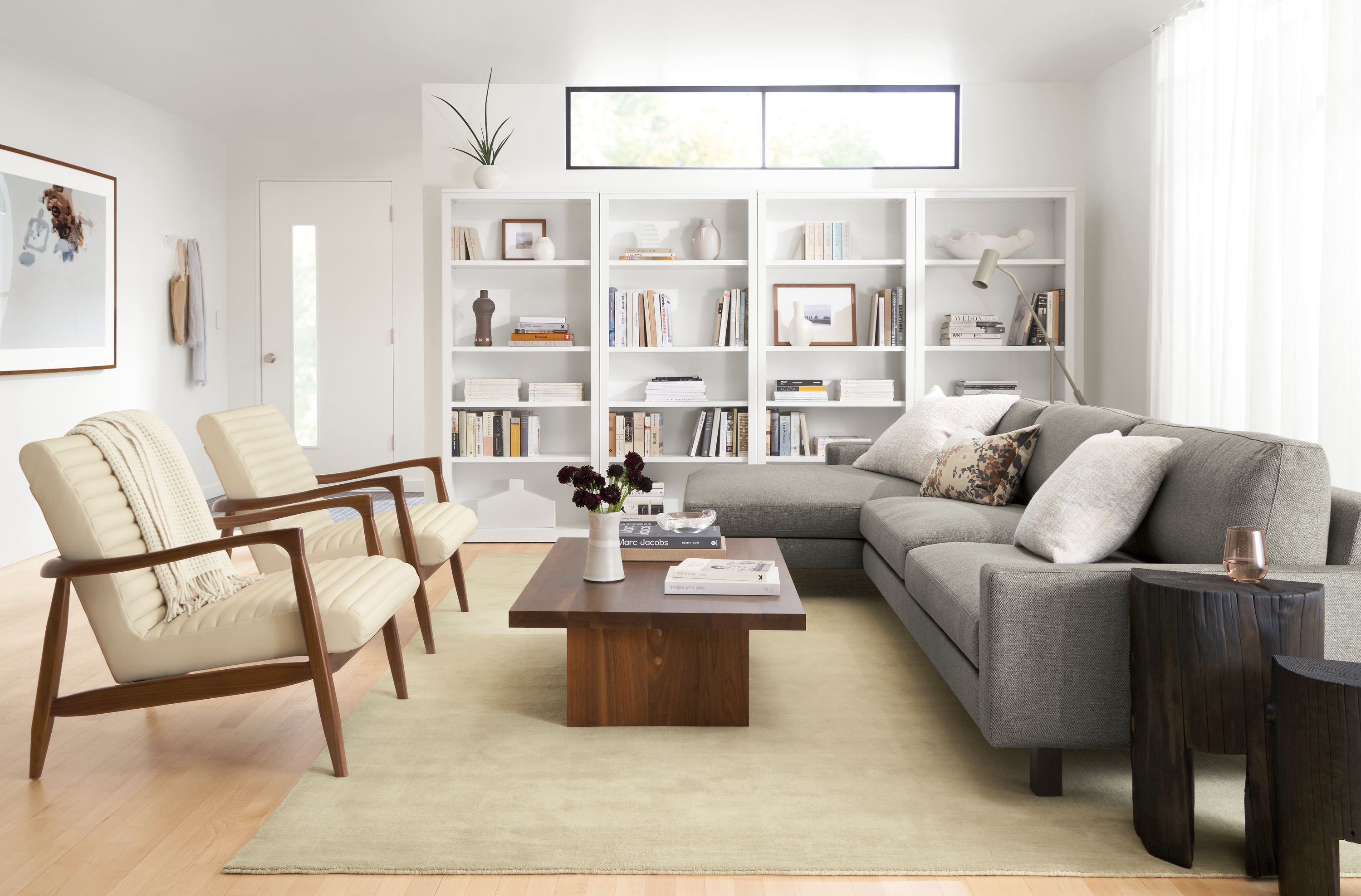 room setting including pierson sofa with chaise, 2 callan chairs and corbett coffee table.