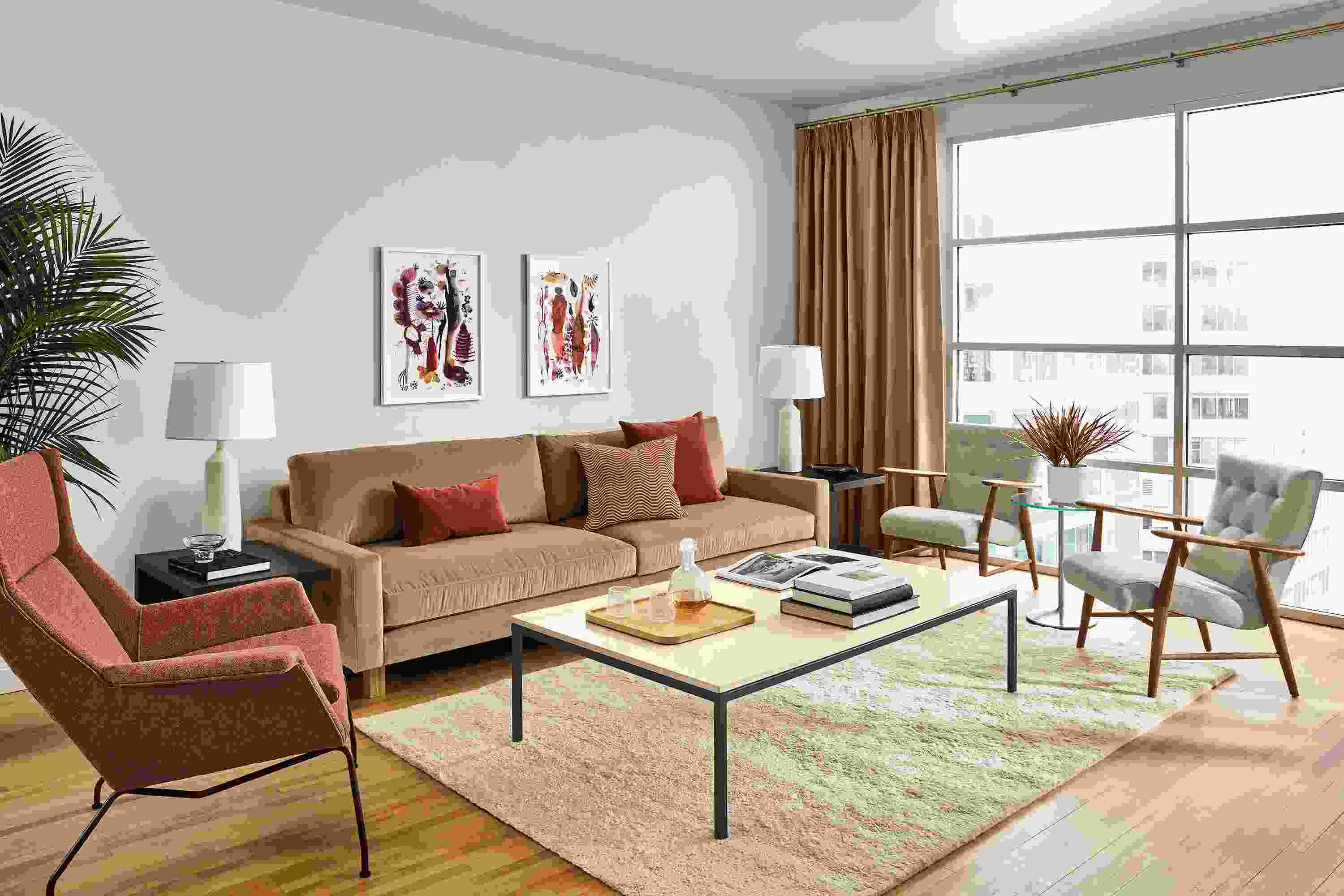 living room with pierson sofa in vance taupe fabric and wood base with aram rug in ecru.
