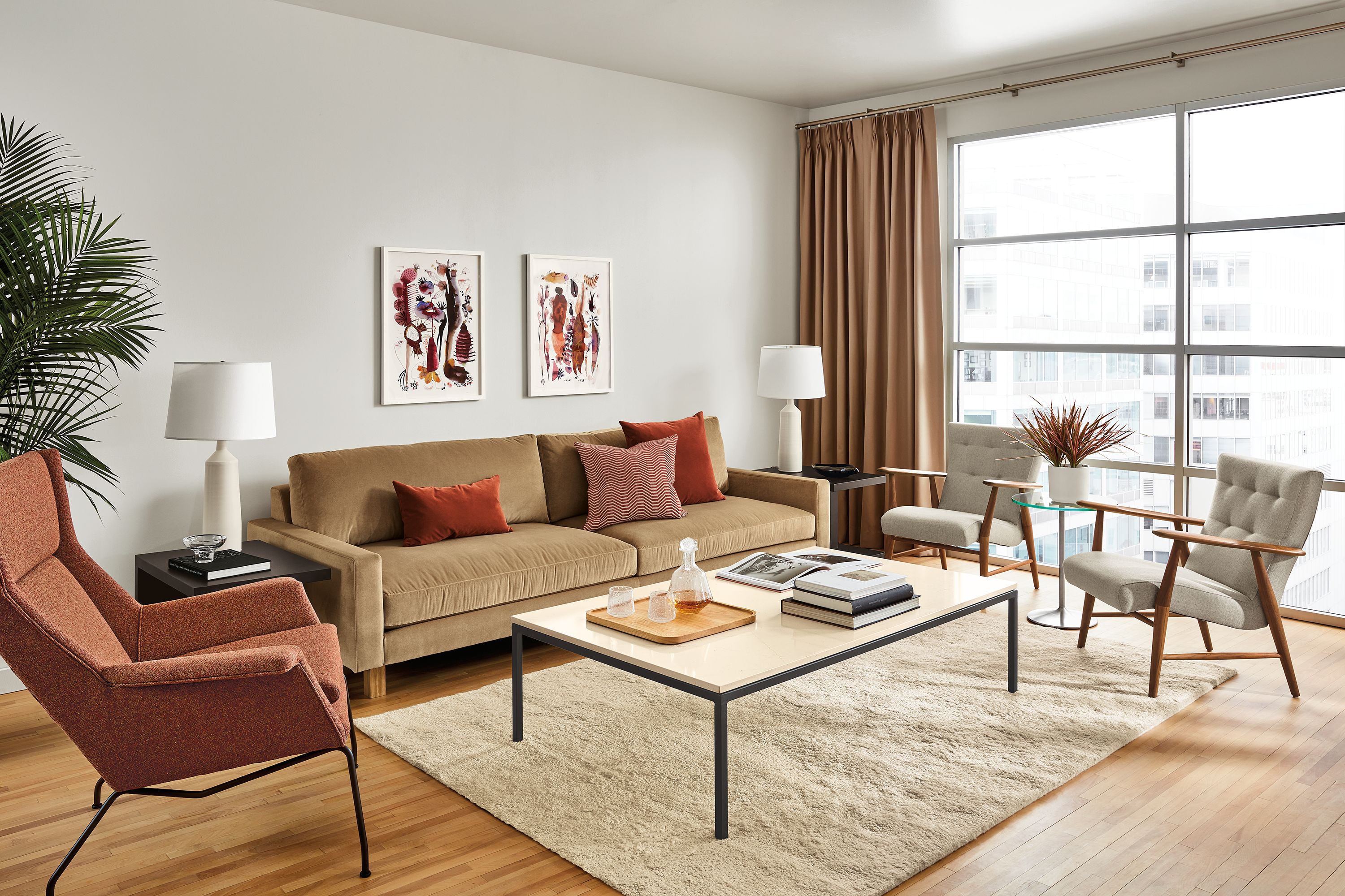 living room with pierson sofa in vance taupe fabric and wood base with aram rug in ecru.