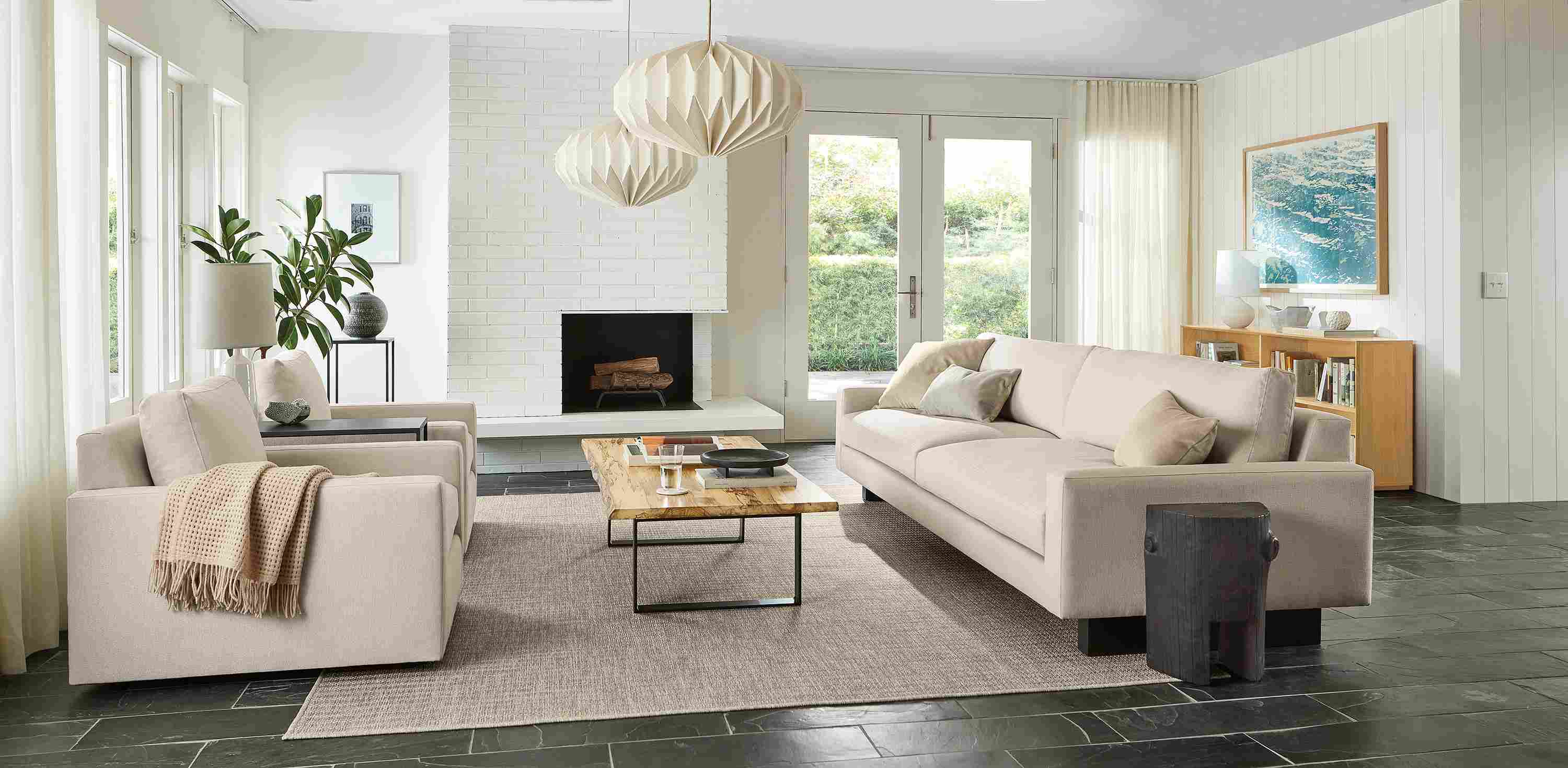 Living room with Pierson sofa and Linger chairs in Hines oatmeal,  and Chilton coffee table in spalted sugarberry.