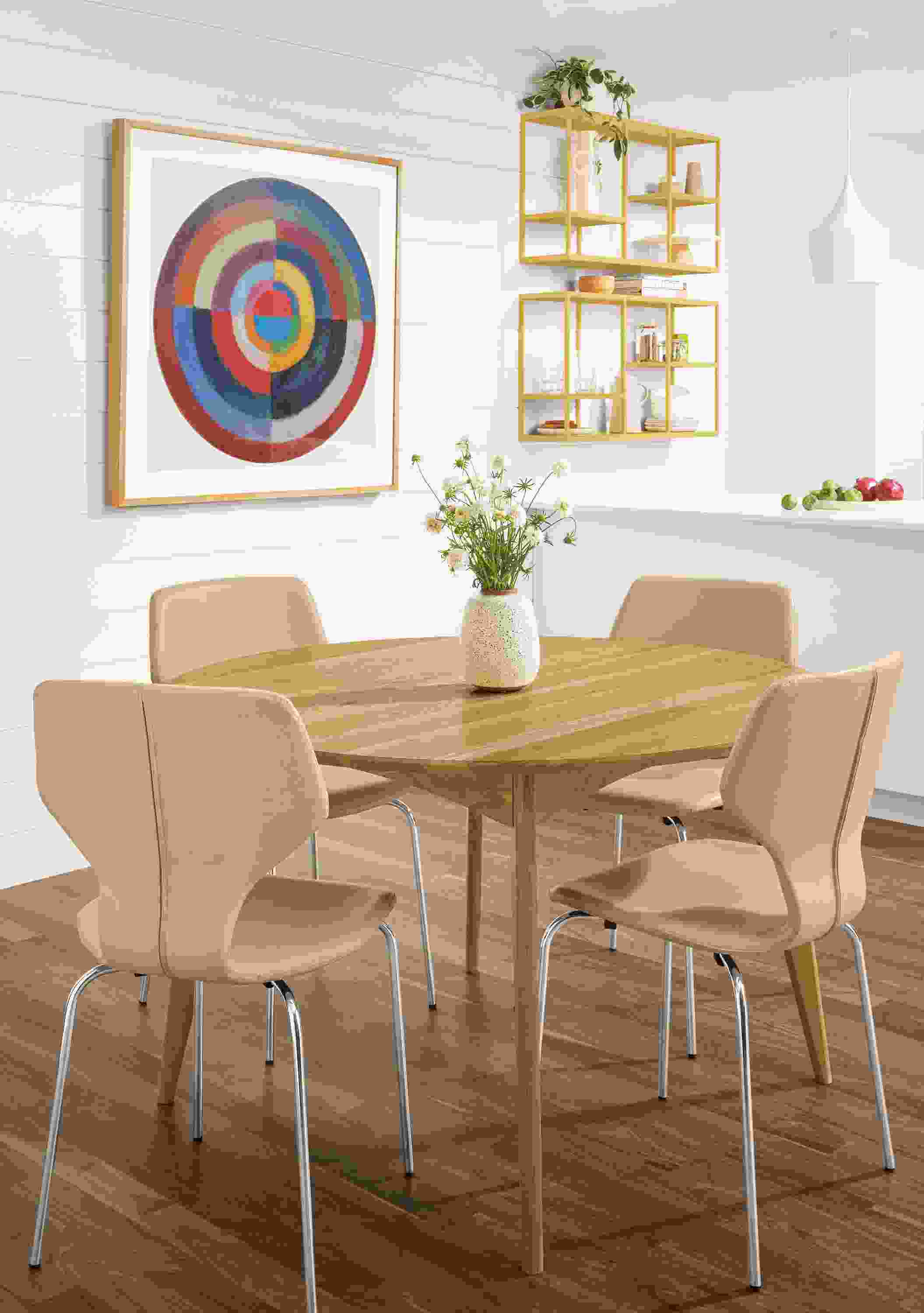 Detail of 4 Pike side chairs in Buff Nola leather at round table.