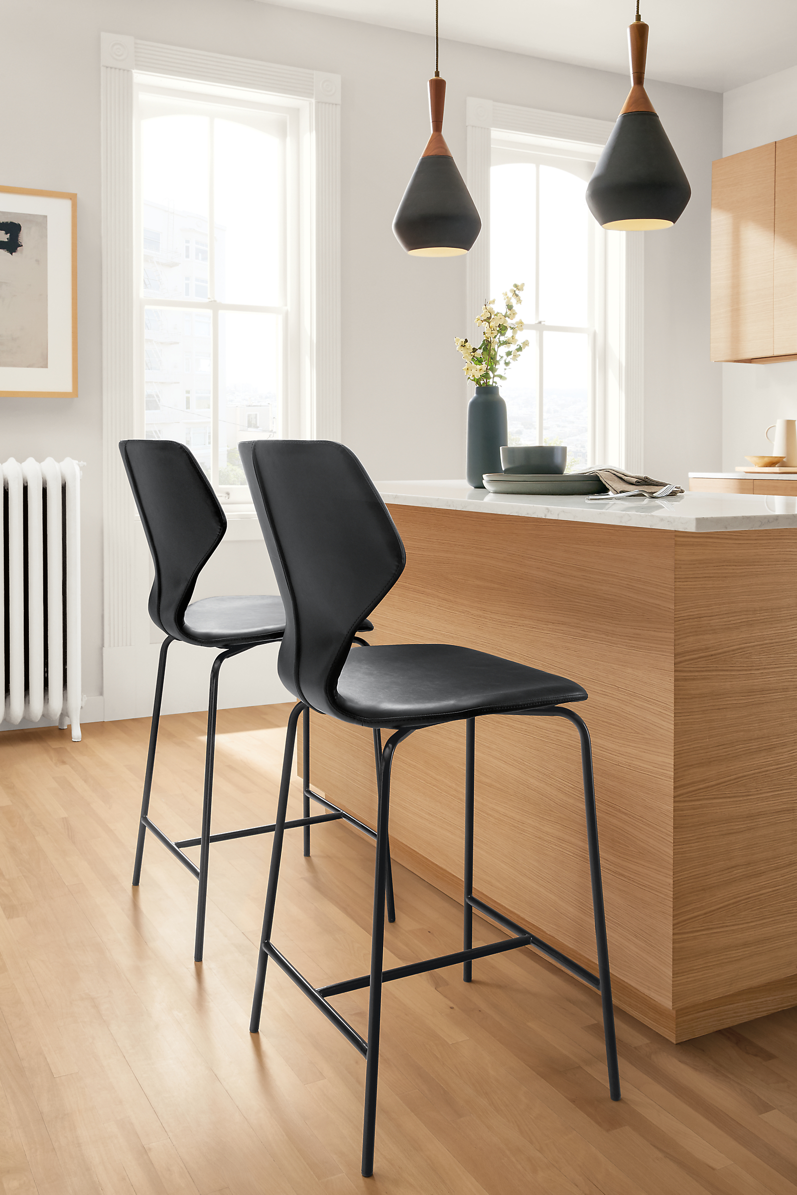 Side detail of black Pike synthetic leather stools.