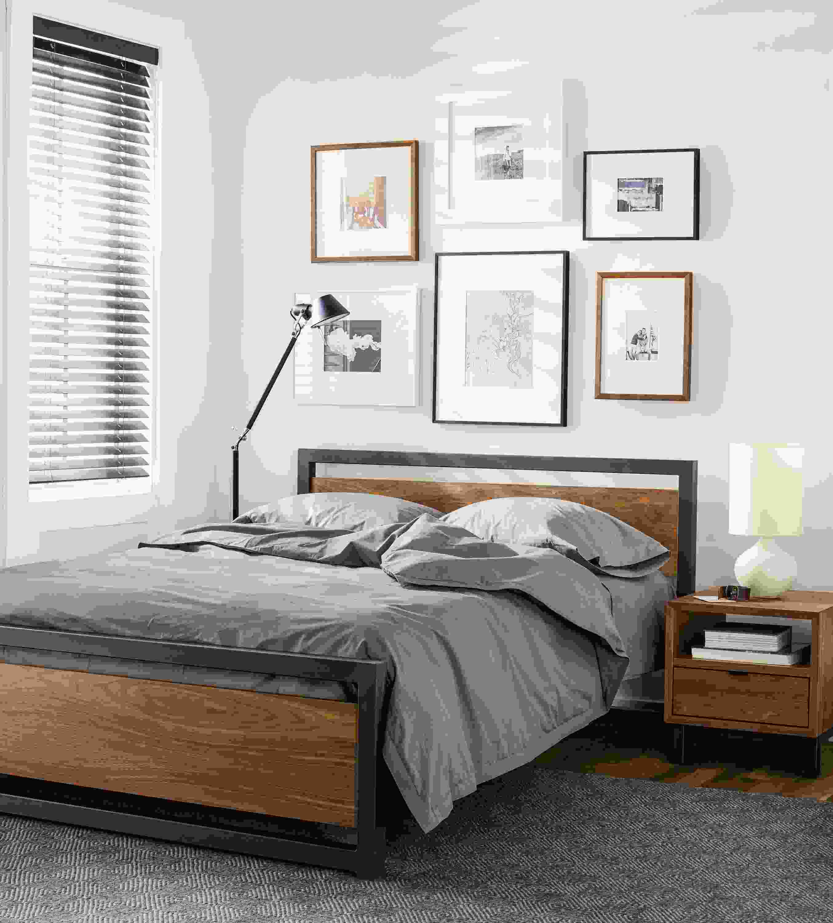 Detail of Piper queen bed with wood panels and natural steel frame.