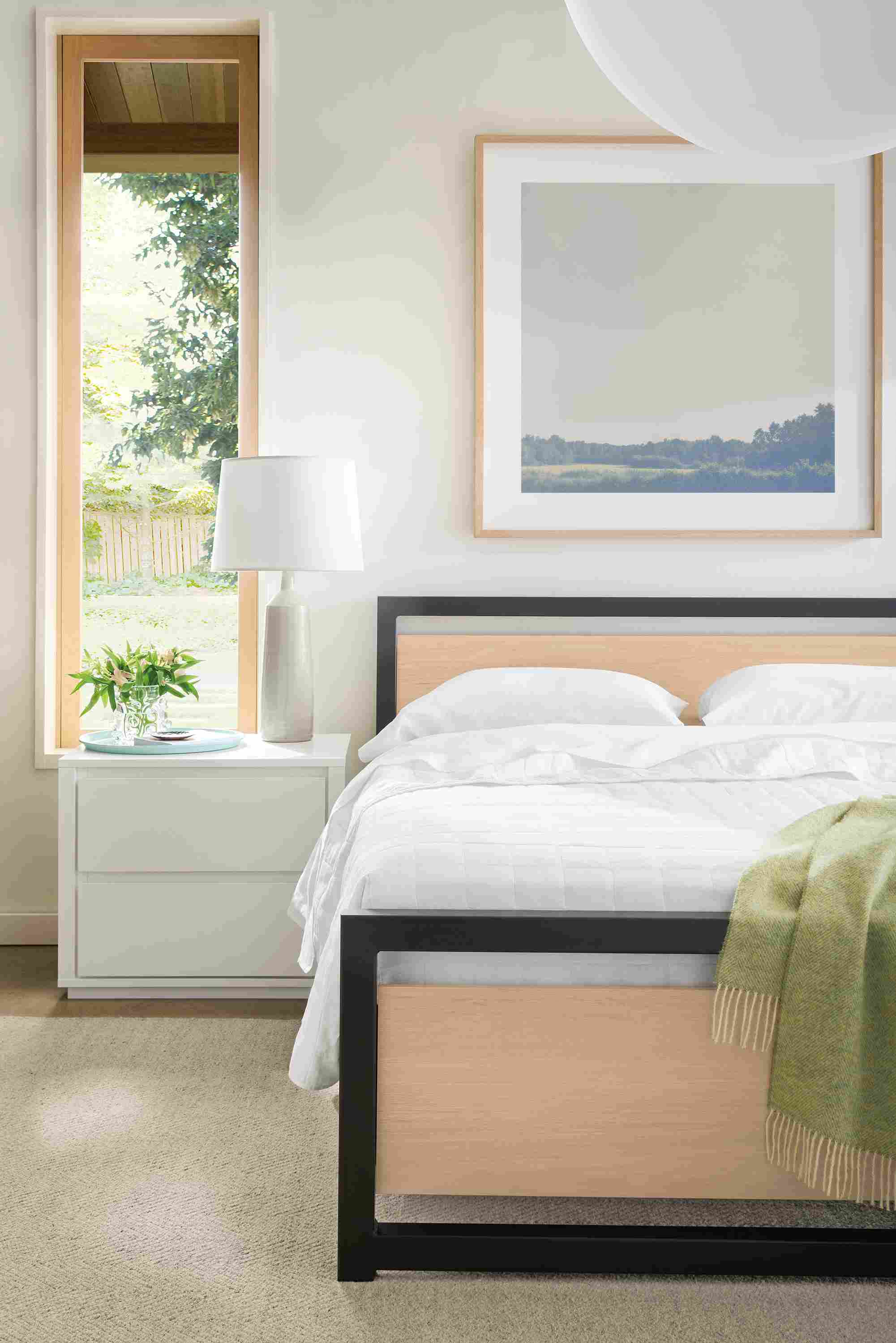 Bedroom with detail of Piper queen bed with salt on red oak panels and natural steel frame.