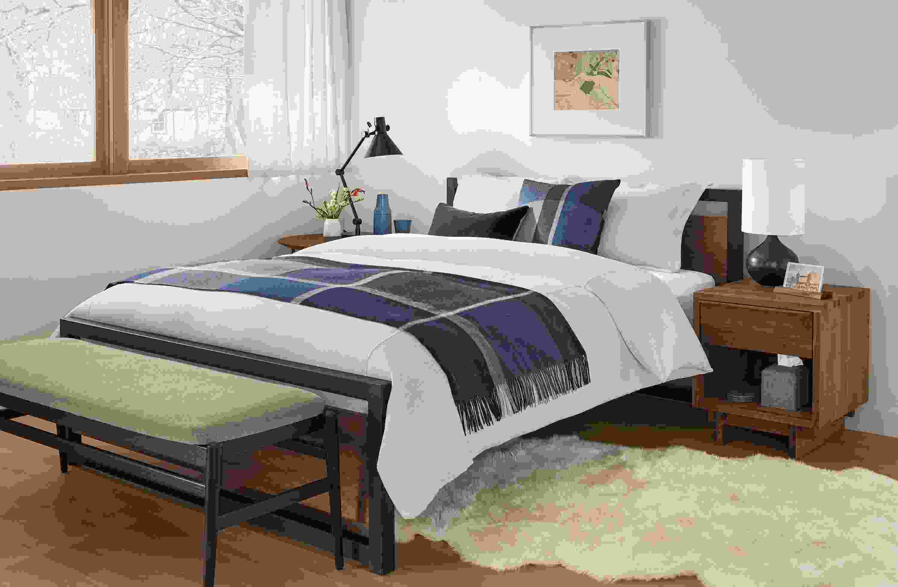 Bedroom with Piper Queen bed in walnut and natural steel and Evan bench in Myers Taupe.