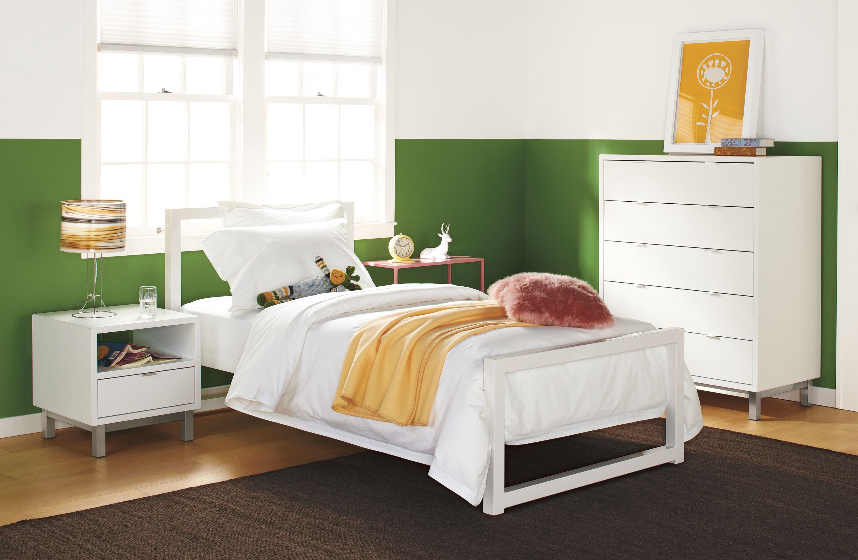 Detail of Piper twin bed in white powder coated steel with white sheets.