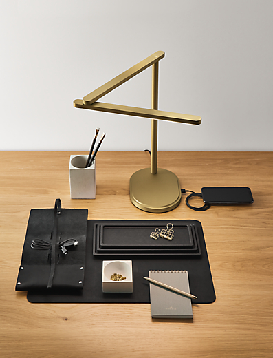Office setting with Pivot task lamp in brushed gold.