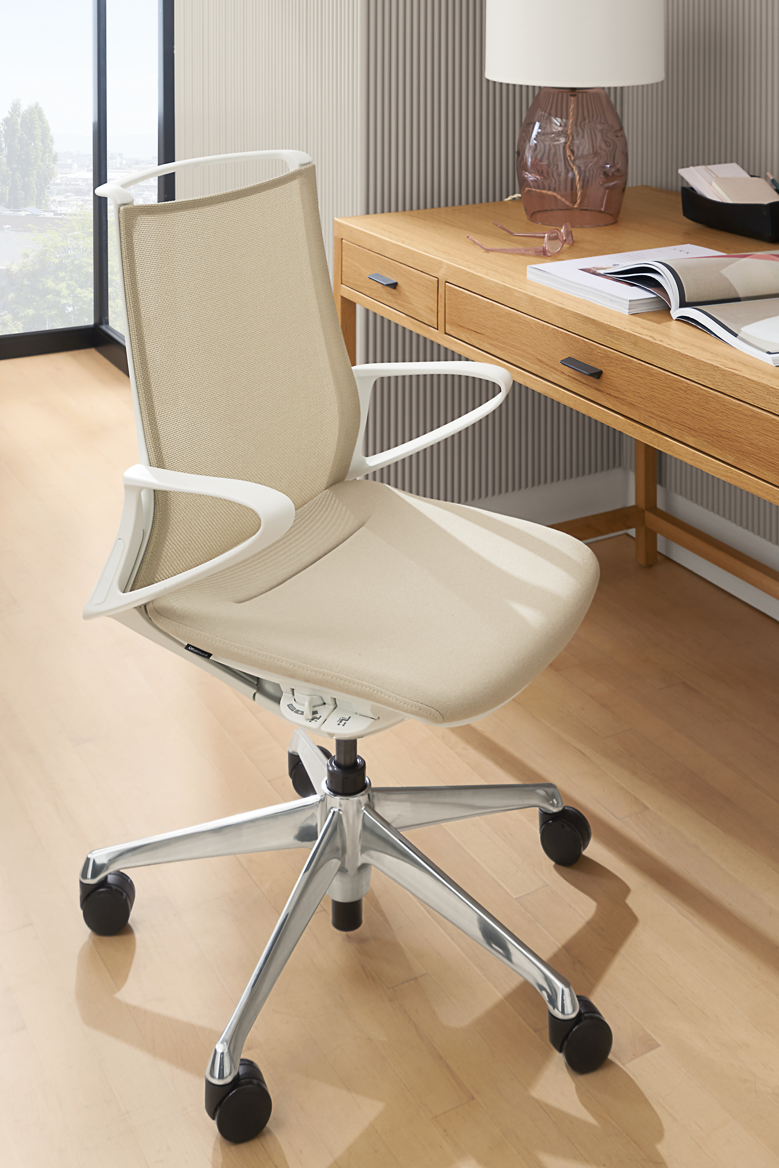 Office setting with Plimode office chair in white with oatmeal mesh.