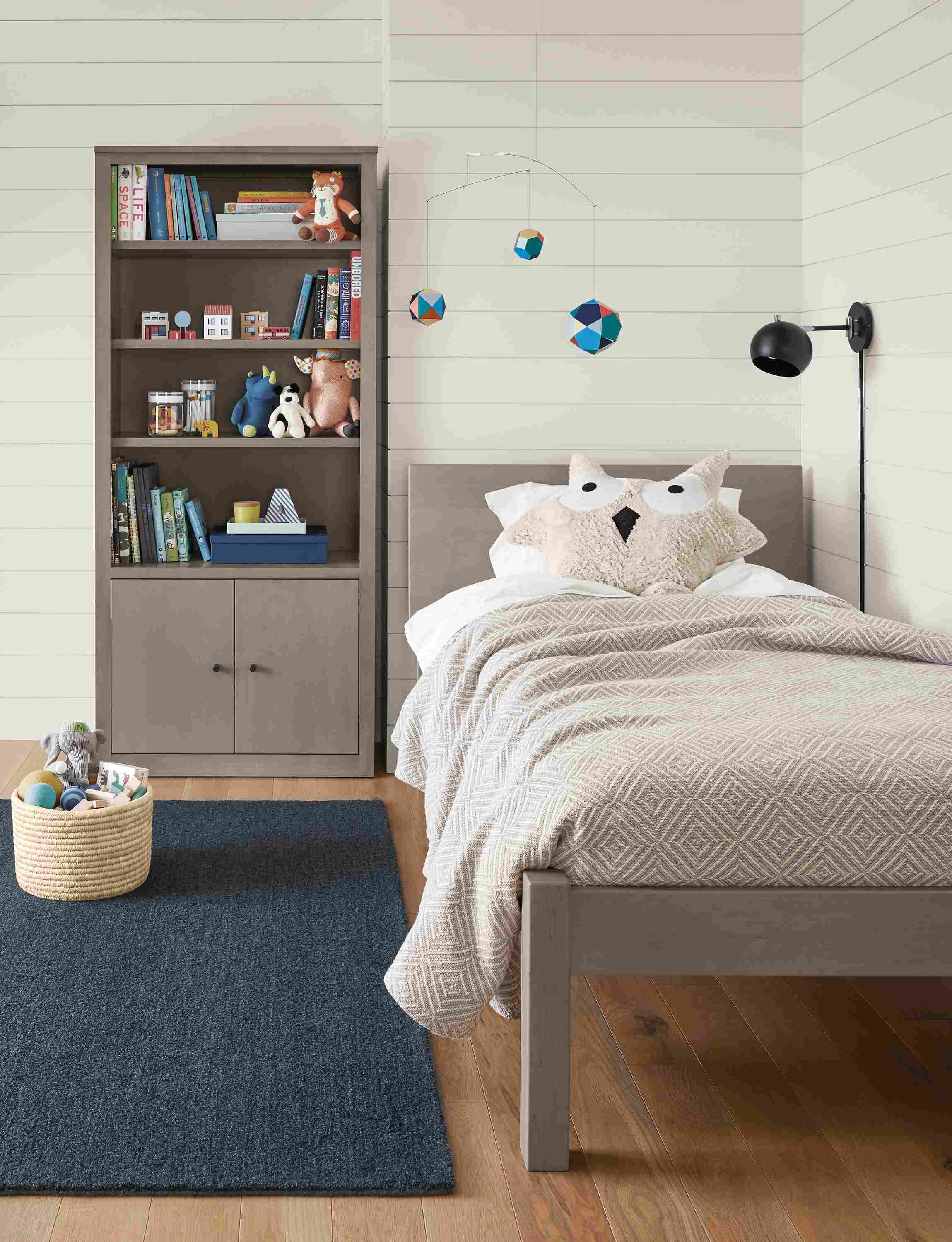 Detail of kids Pogo twin bed in maple with shell stain.