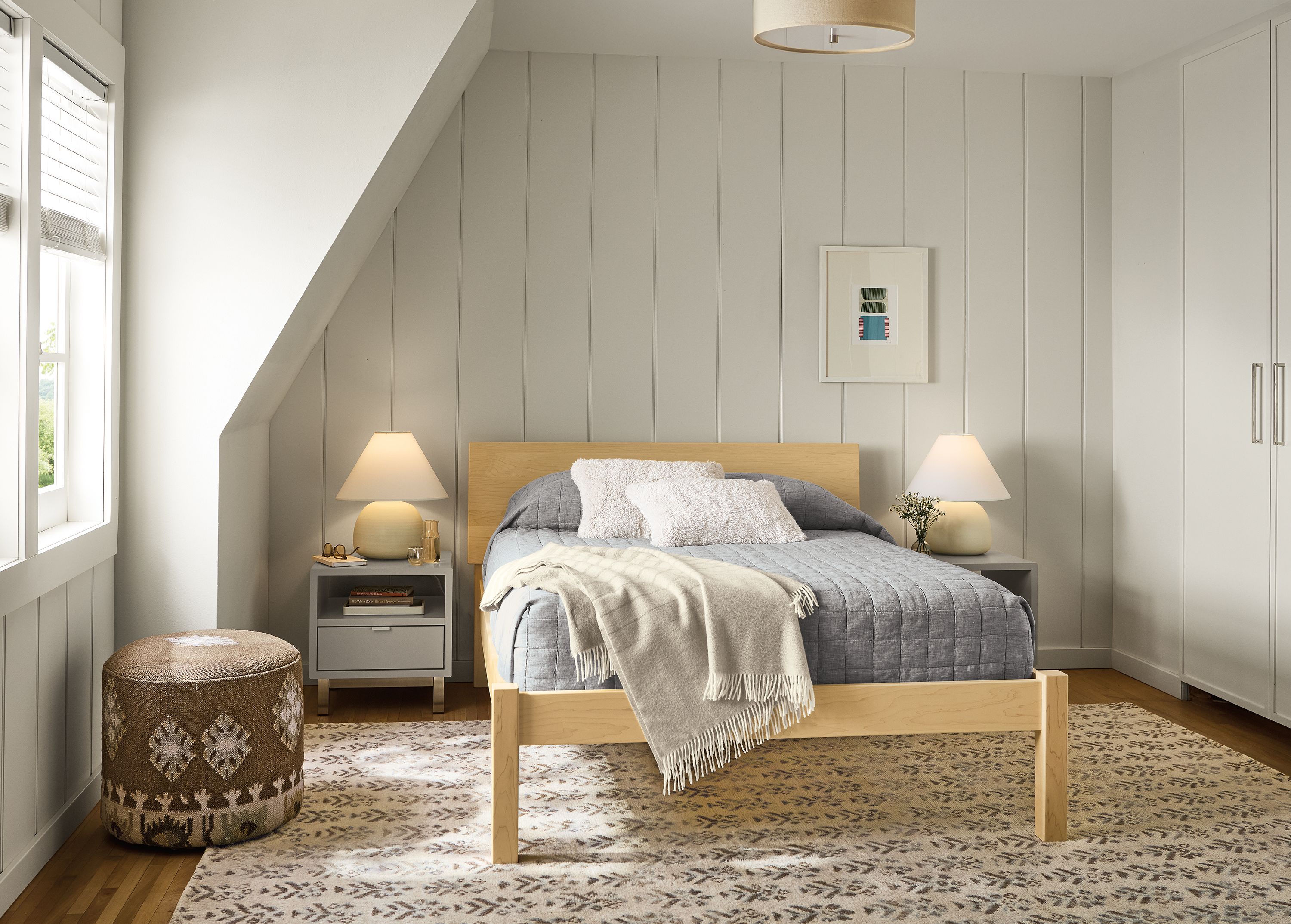 Bedroom with Pogo bed in maple, 2 copenhagen nightstands in taupe and Leyla rug in snow.