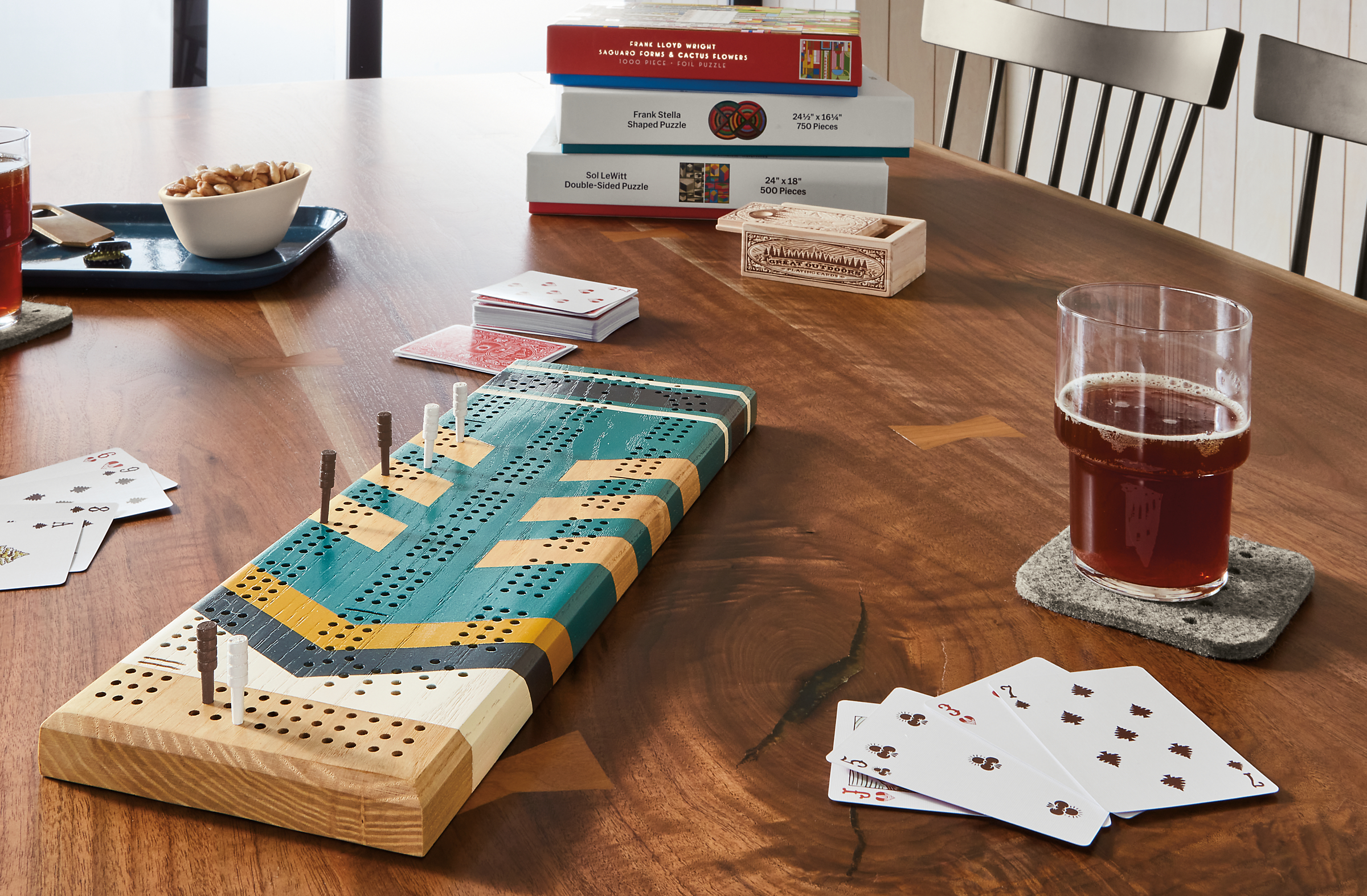 Home décor setting with Portage cribbage board and Great Outdoor playing cards.