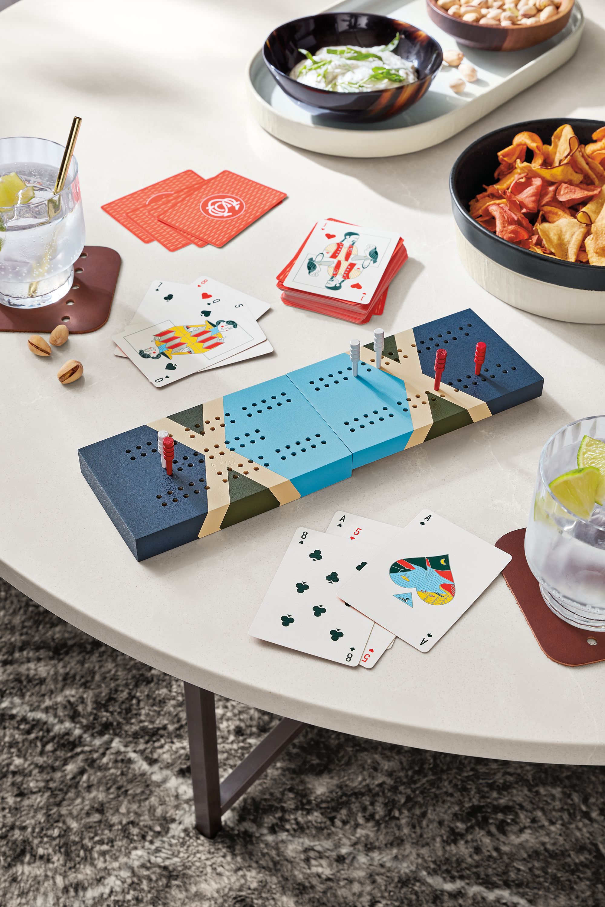 Classic coffee table with snacks and Portage travel cribbage board with Scout playing cards.