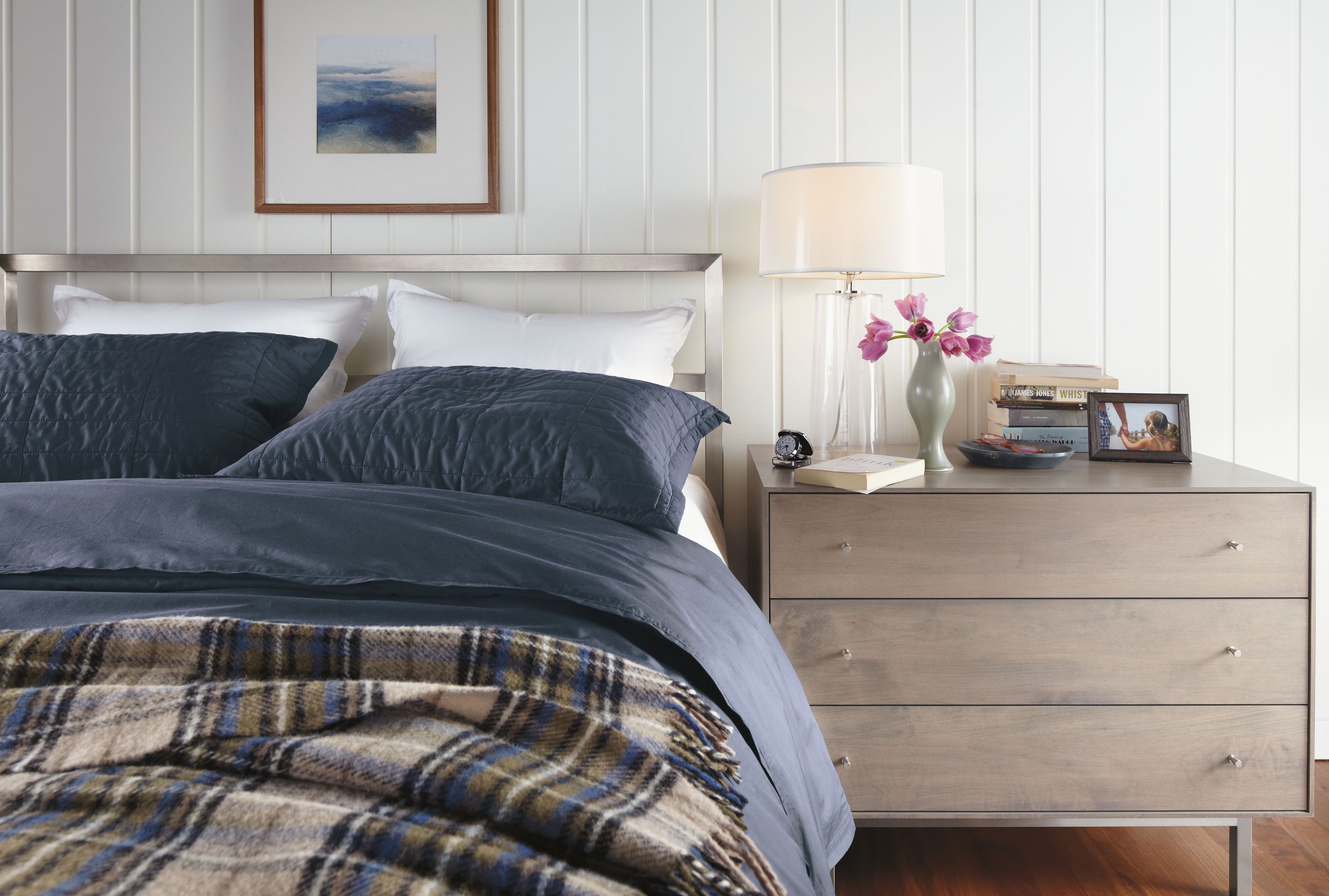 Bedroom with Parsons stainless steel low bed in stainless steel.