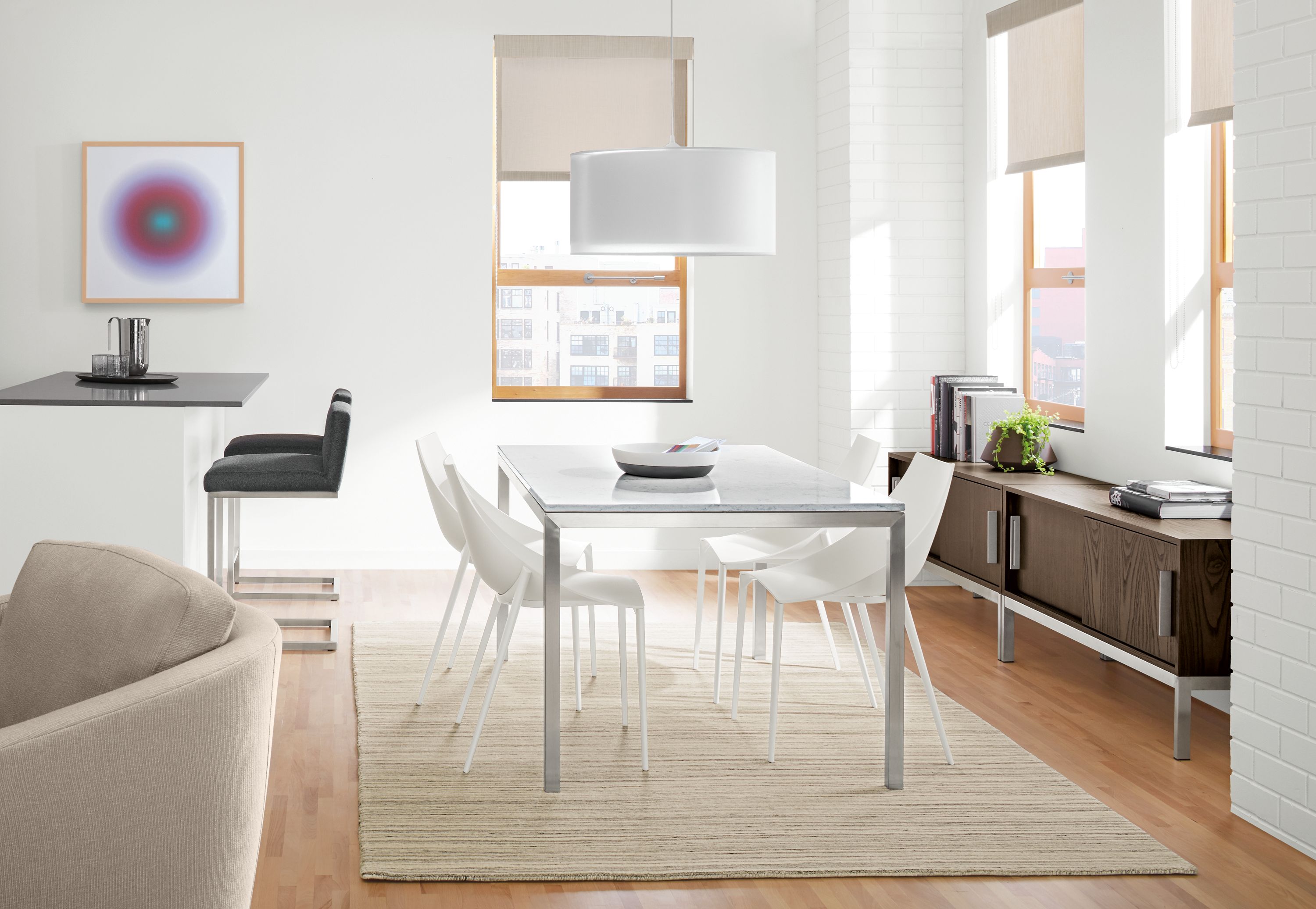 Parsons stainless steel dining table with marbled white top.