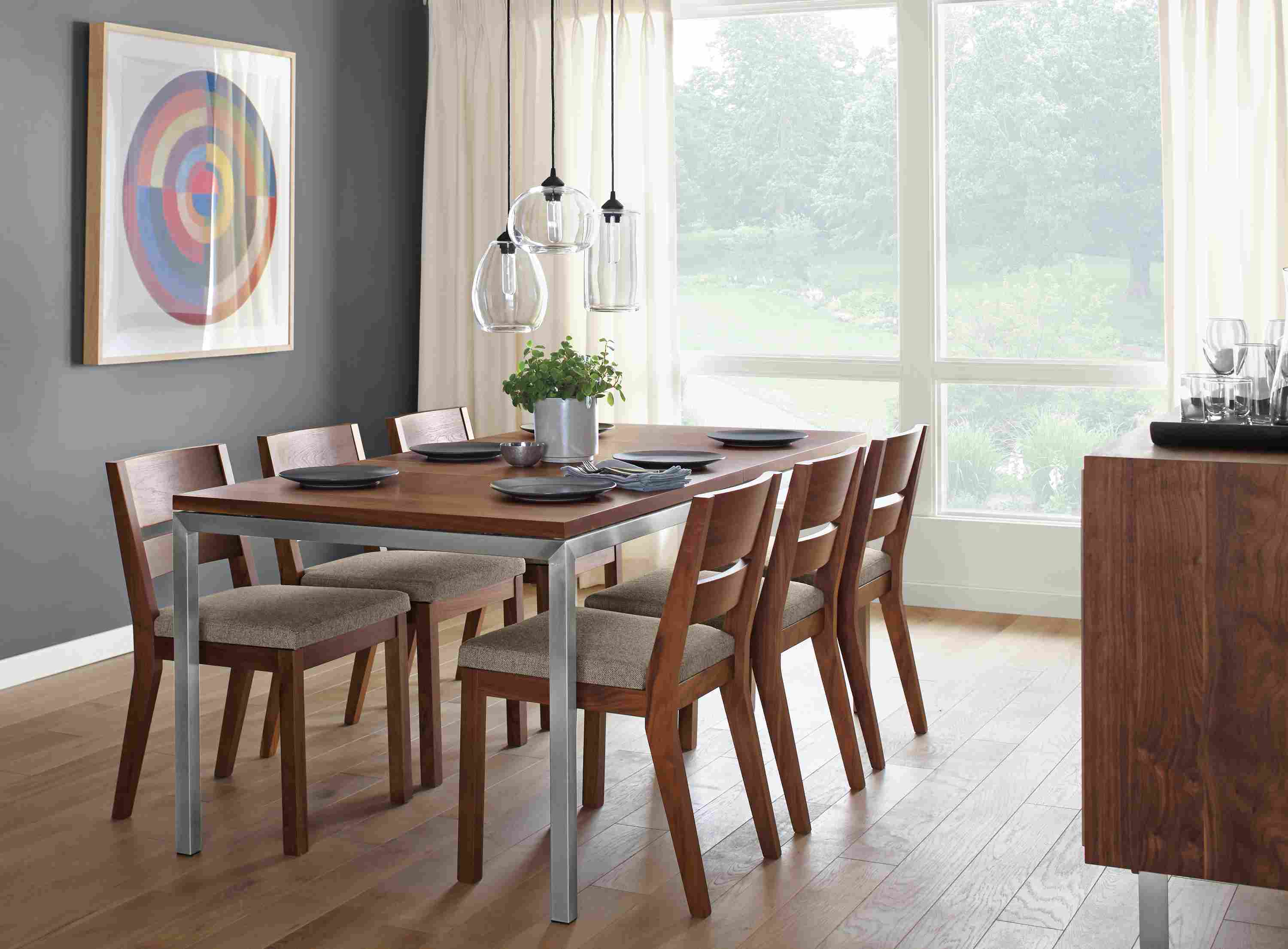 Detail of Parsons stainless steel extension table with stainless steel base and walnut top.