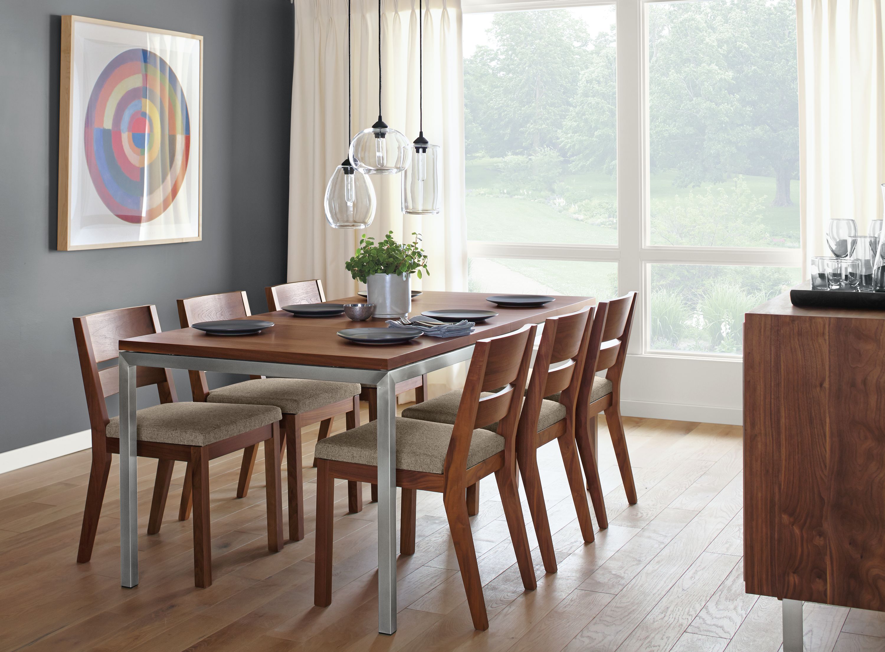 Detail of Parsons stainless steel extension table with stainless steel base and walnut top.