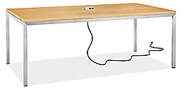 Angled view of Portica 78-wide Table in Maple with Tabletop 3-Port Power and Charging Outlet in silver.