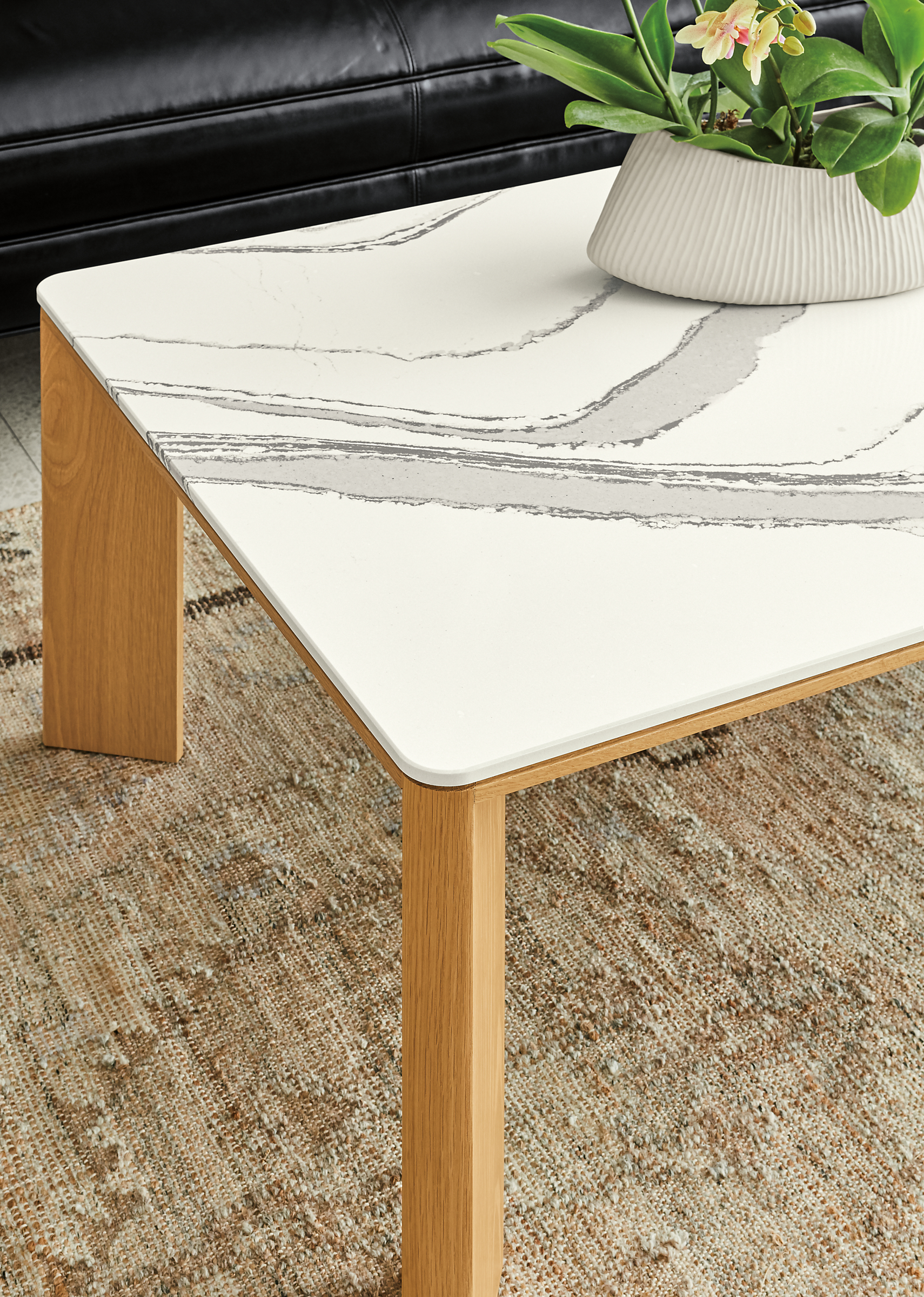 Detail of Pren coffee table in white oak with Cambria Brittanica top.