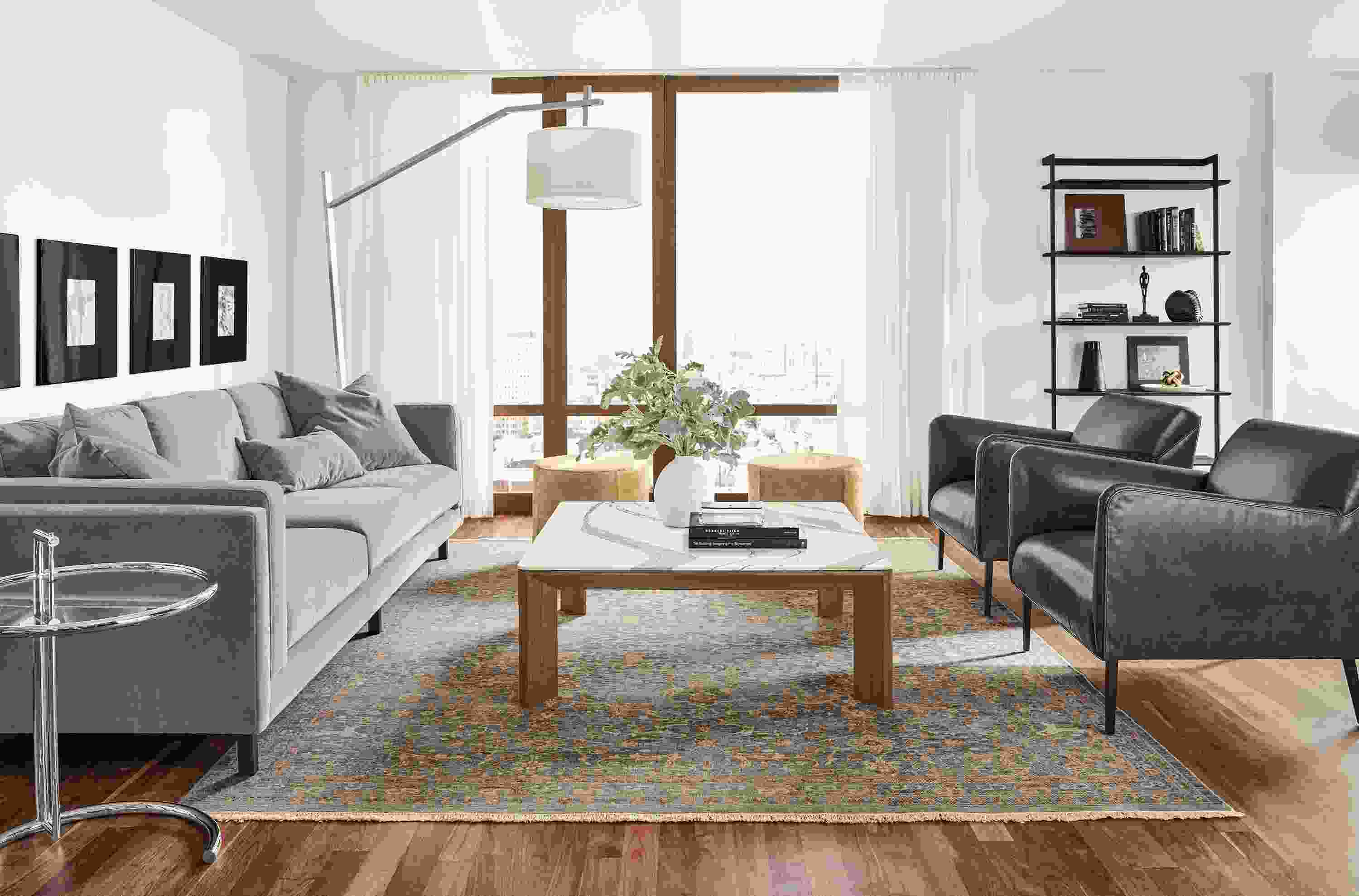 Detail of Pren coffee table in walnut with Cambria Brittanica top in living room.