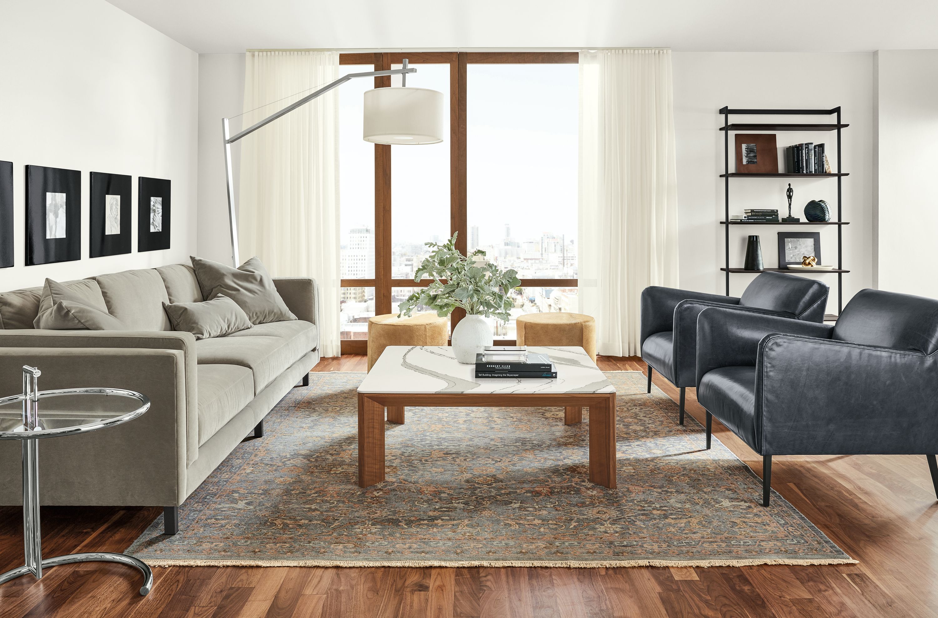 Detail of Pren coffee table in walnut with Cambria Brittanica top in living room.