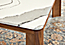 Close-up of corner of Pren coffee table in walnut with Cambria Britannica top.