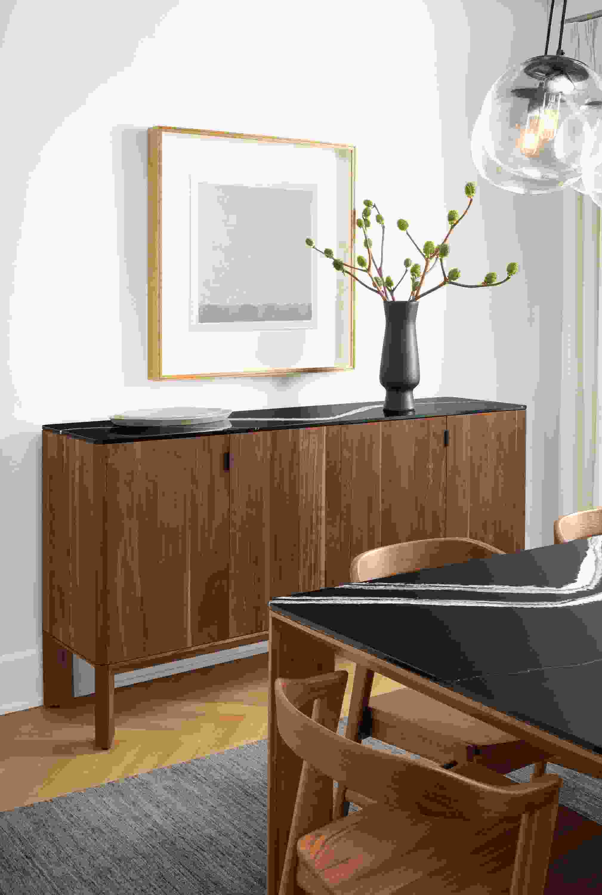 Detail of Pren storage cabinet in walnut with Cambria Mersey top in dining room.