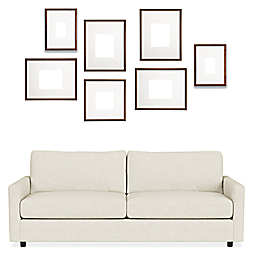 Front view of Profile Organic Picture Frame Set of 7 in Wood with Linger Sofa.