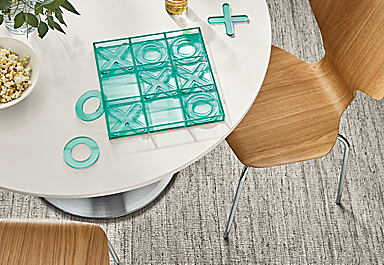 detail of Putnam tic tac toe set on white round dining table.
