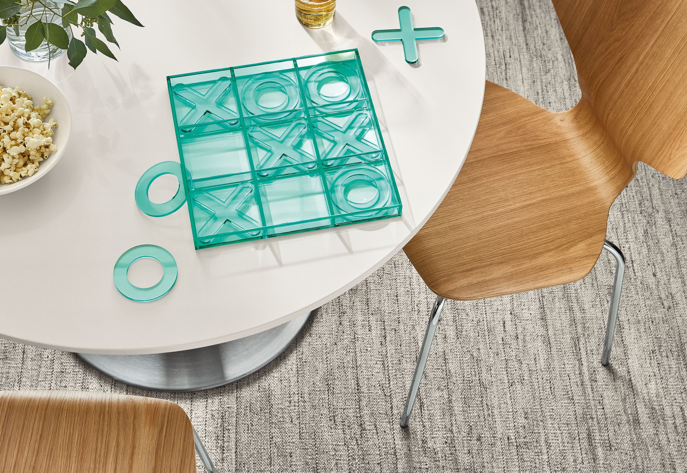 detail of Putnam tic tac toe set on white round dining table.