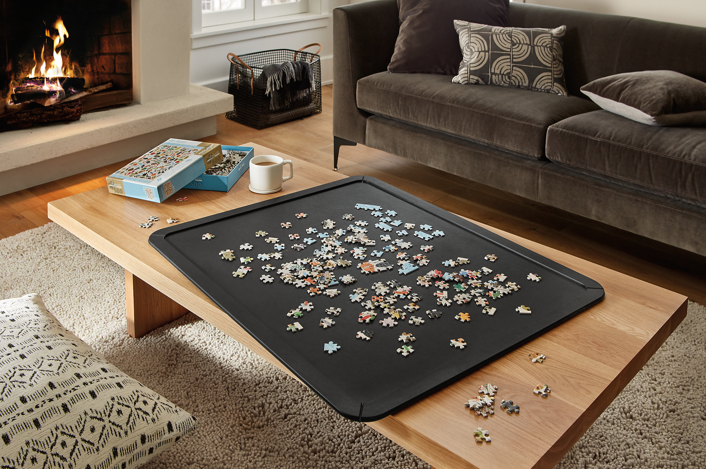 Puzzle board in slate with Corbett 60-wide coffee table.