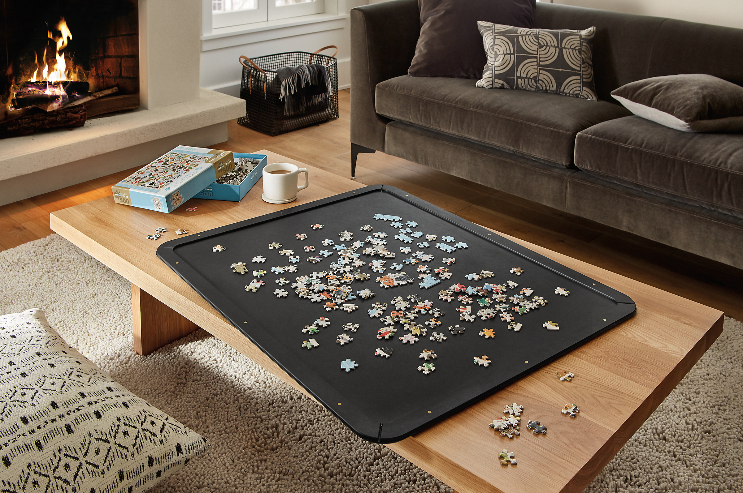 Puzzle board in slate with Corbett 60-wide coffee table in white oak.