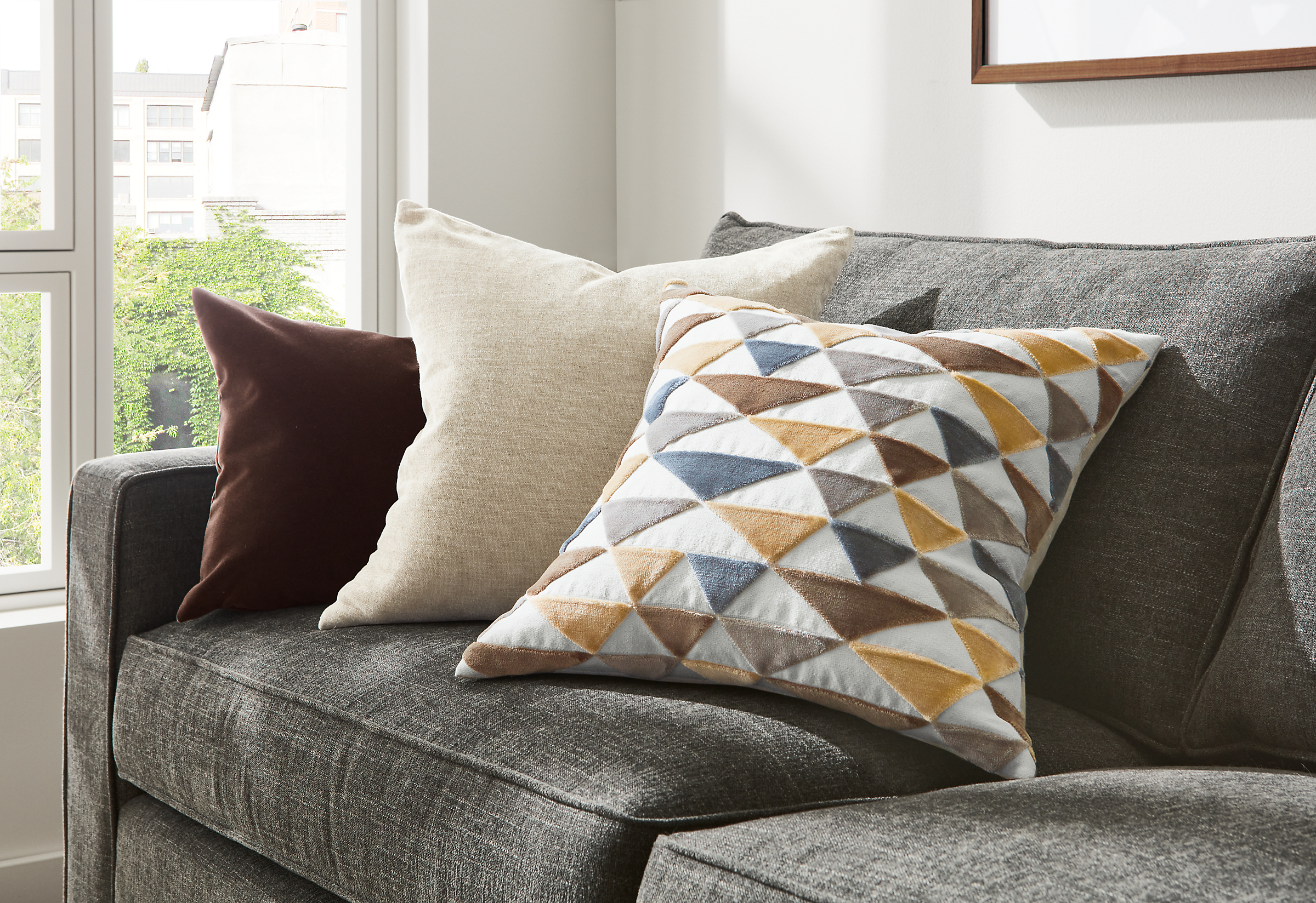Pyramid pillow, Burton pillow and Velvet pillow on York sofa.