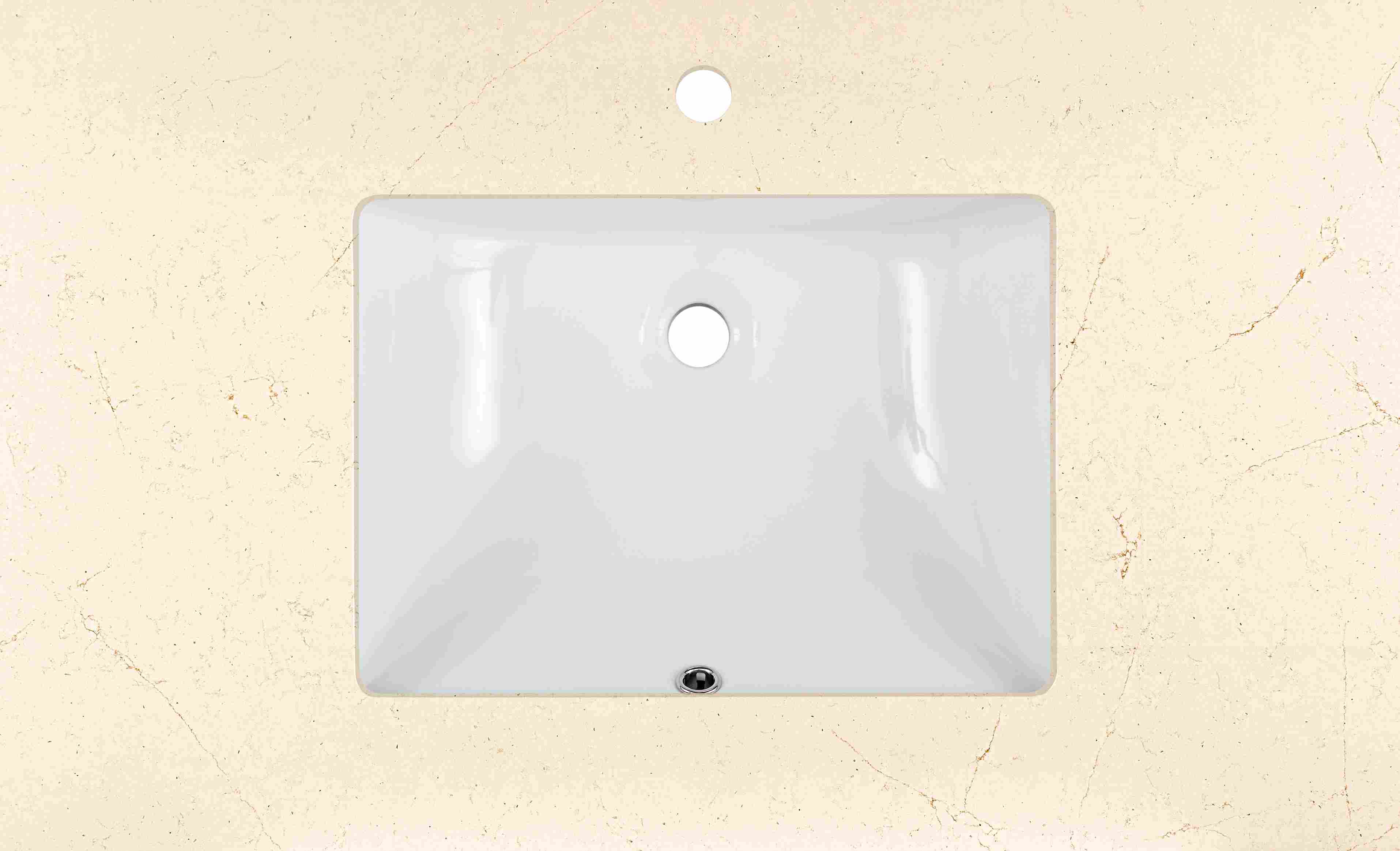 Top down detail of Vanity top in ecru quartz with rectangle sink and one facet hole.