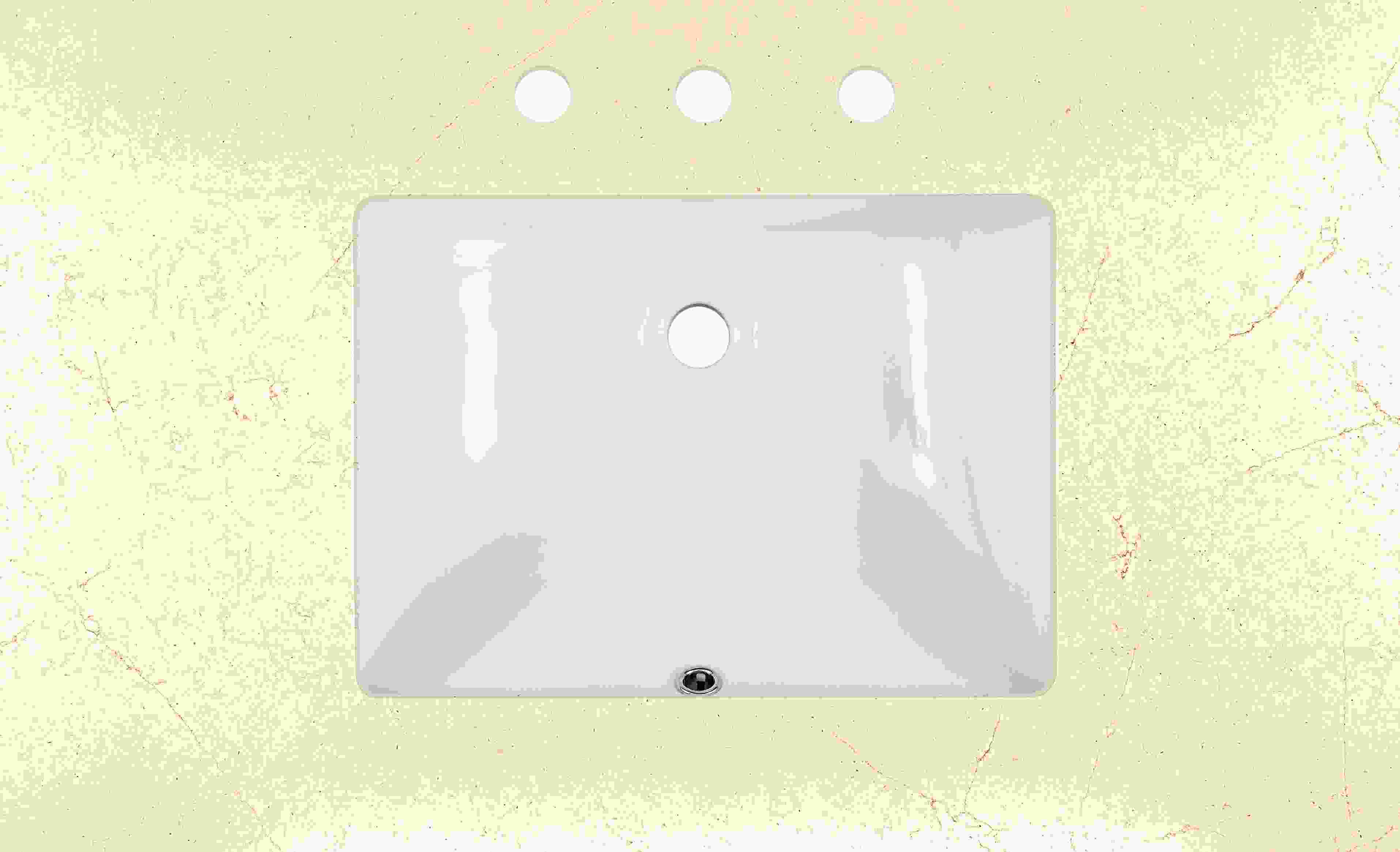 Top down detail of Vanity top in ecru quartz with rectangle sink and three facet holes.