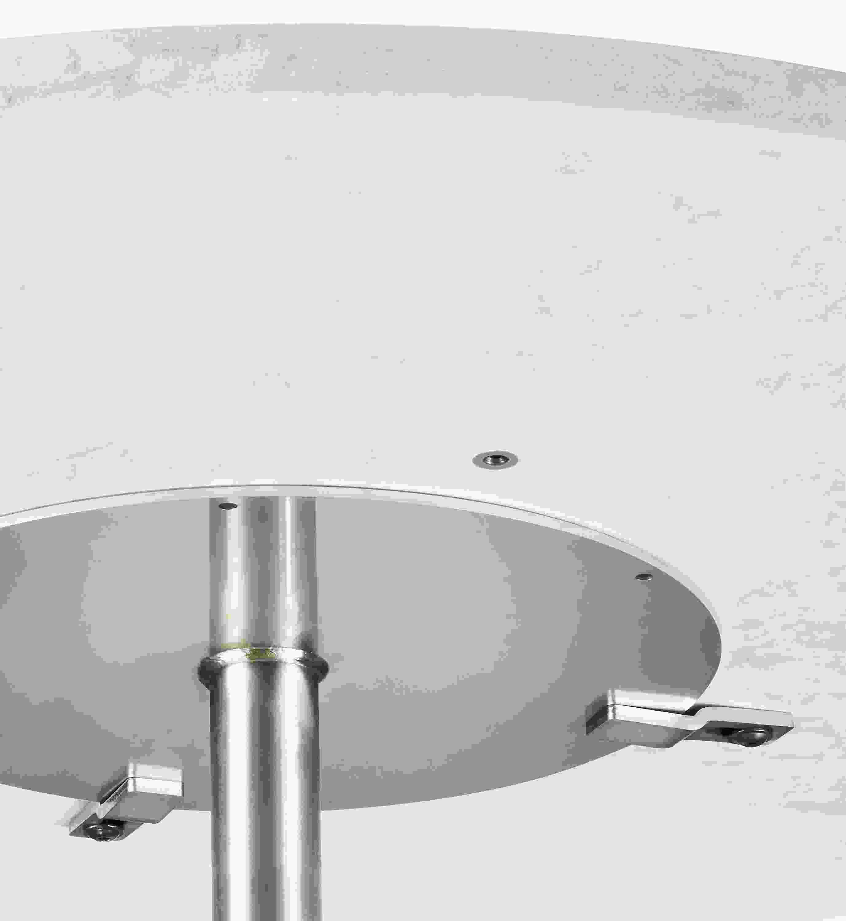 underside detail of round quartz top showing base attachment.