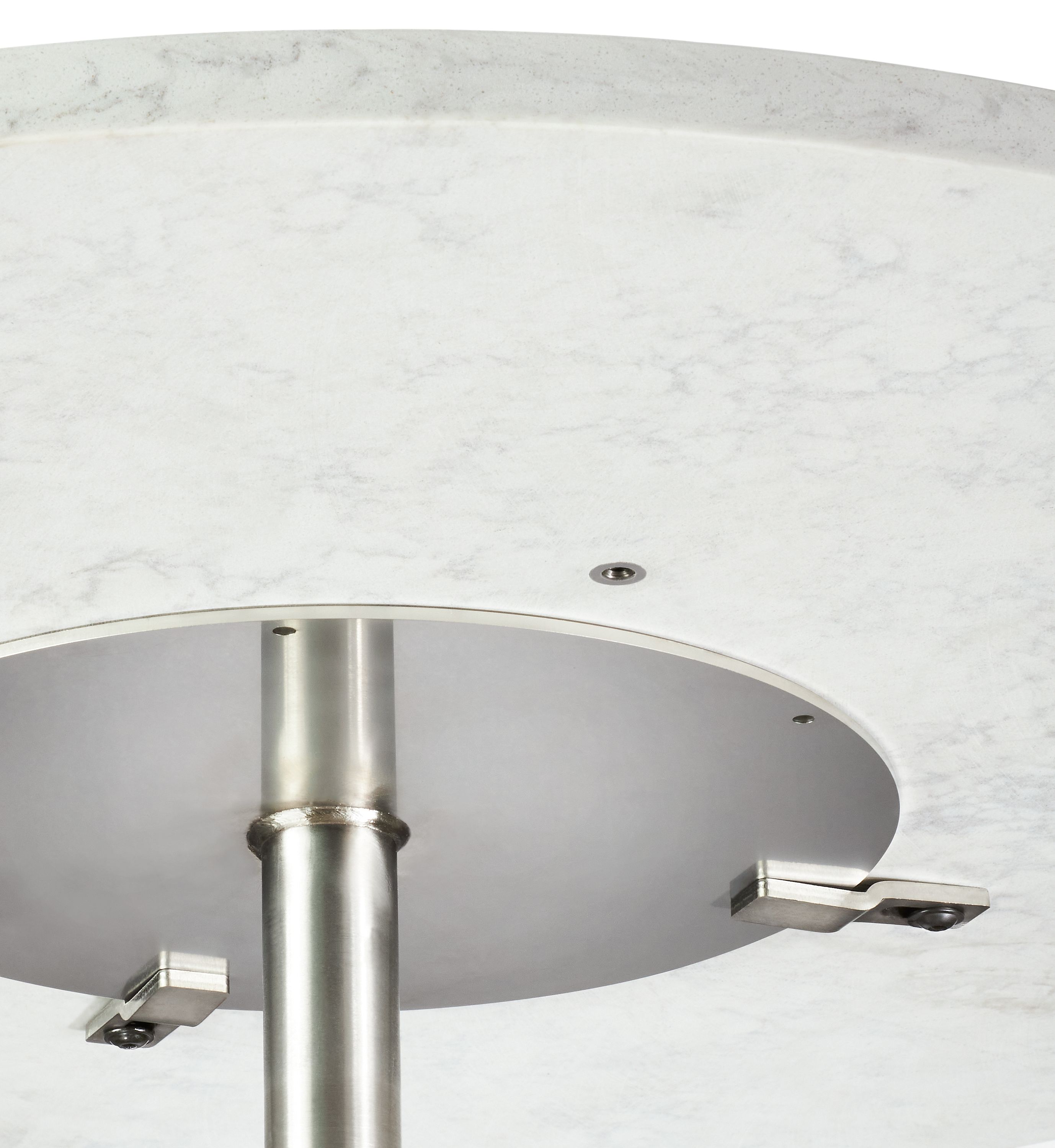 underside detail of round quartz top showing base attachment.