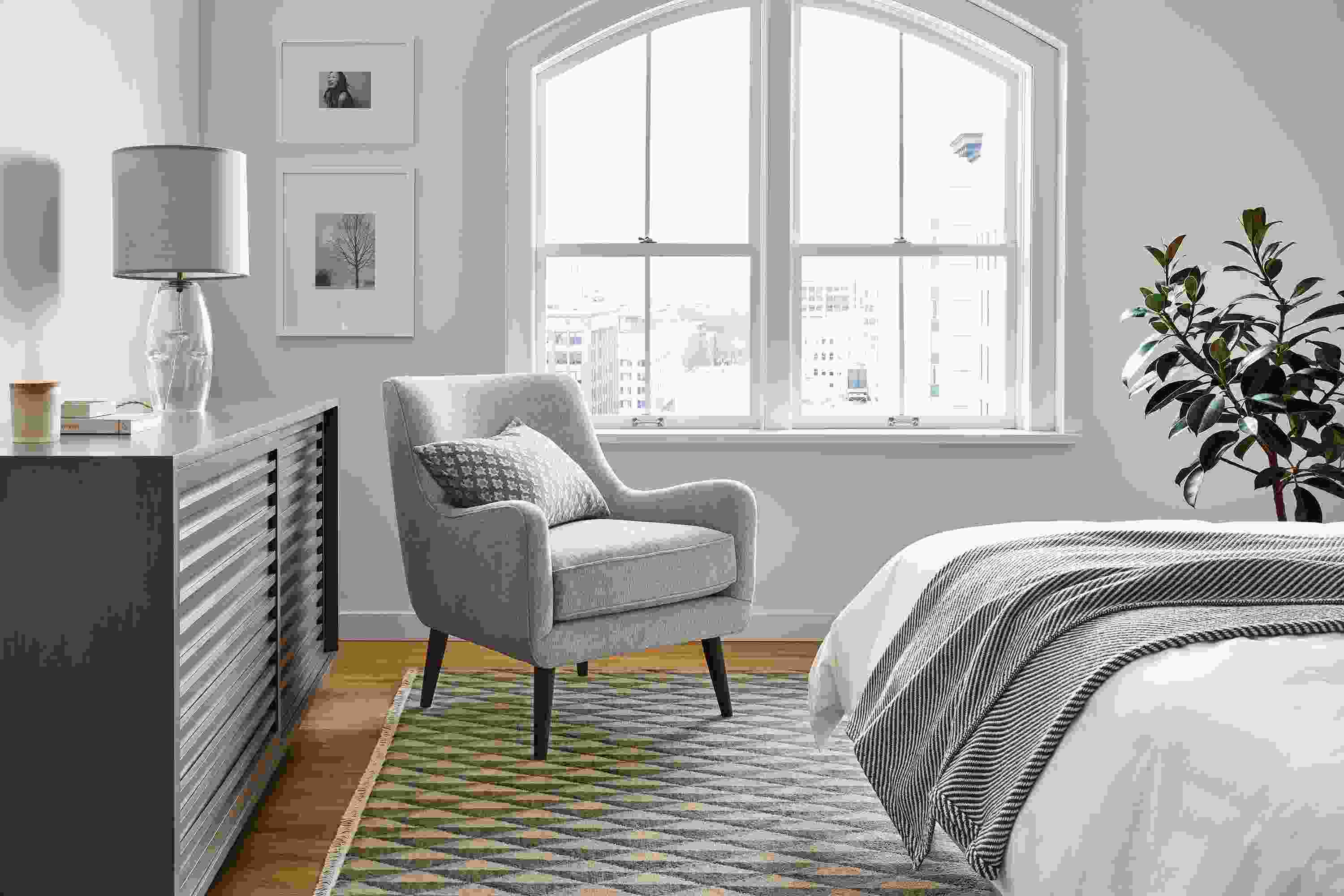 Bedroom with Quinn Chair in Hawkins Cadet, Moro 72-wide Storage Cabinet in charcoal and Plaza Rug in Green and Slate.