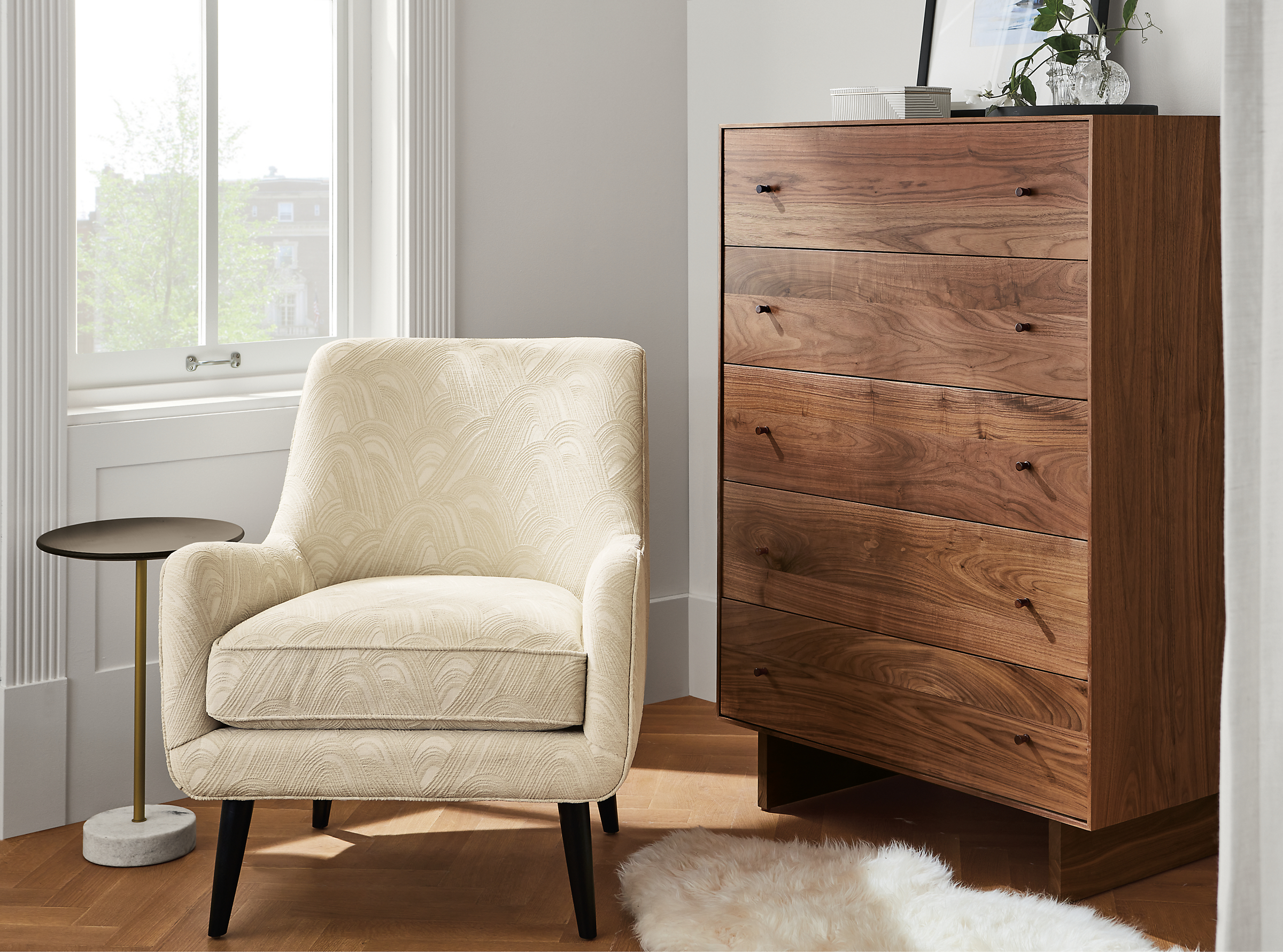 Detail image of quinn chair in Noloni Ivory and Hudson dresser in walnut.