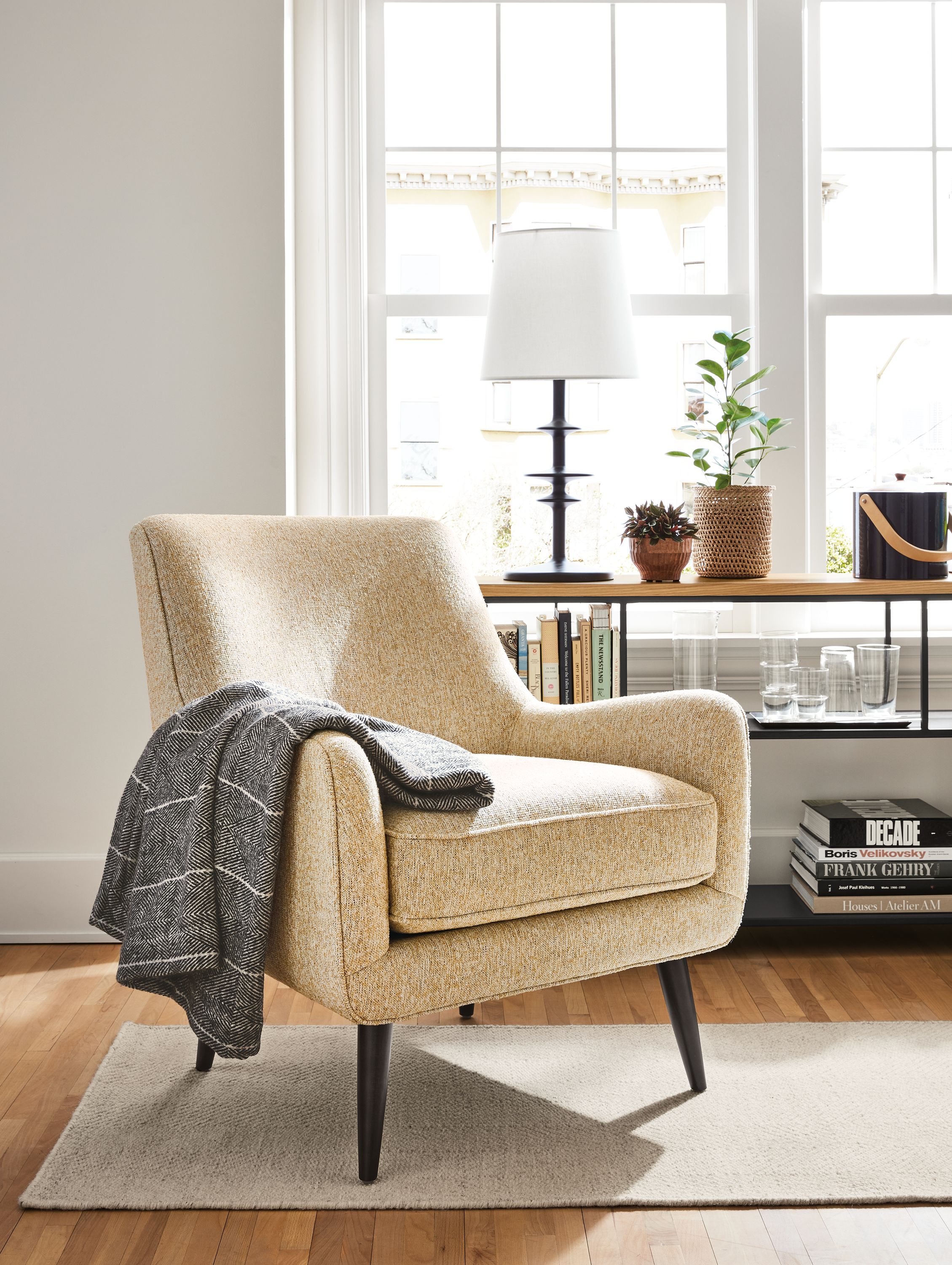 Living room with Quinn chair in Conley saffron.